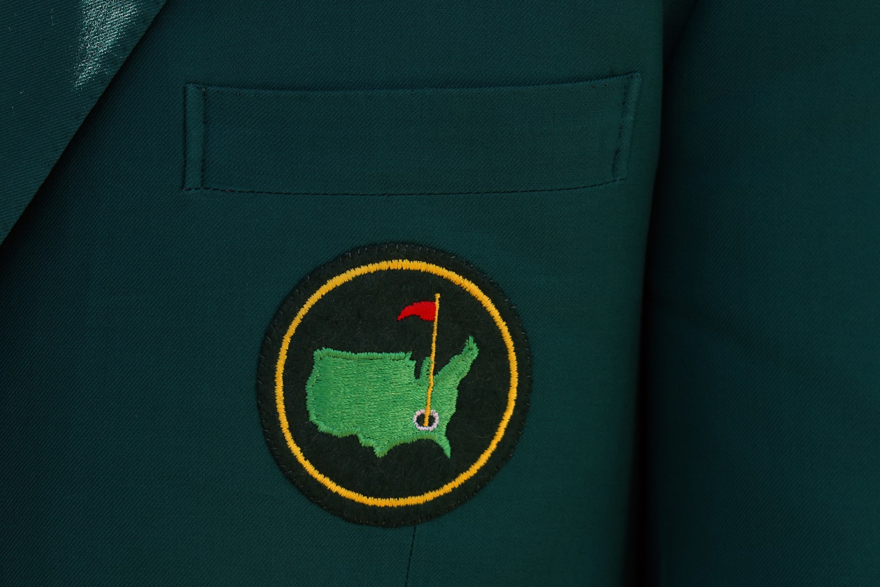 AUGUSTA, GEORGIA - APRIL 07: A detail view of the Augusta National Golf Club logo on a green jacket during the first round of the Masters at Augusta National Golf Club on April 07, 2022 in Augusta, Georgia. (Photo by Andrew Redington/Getty Images)