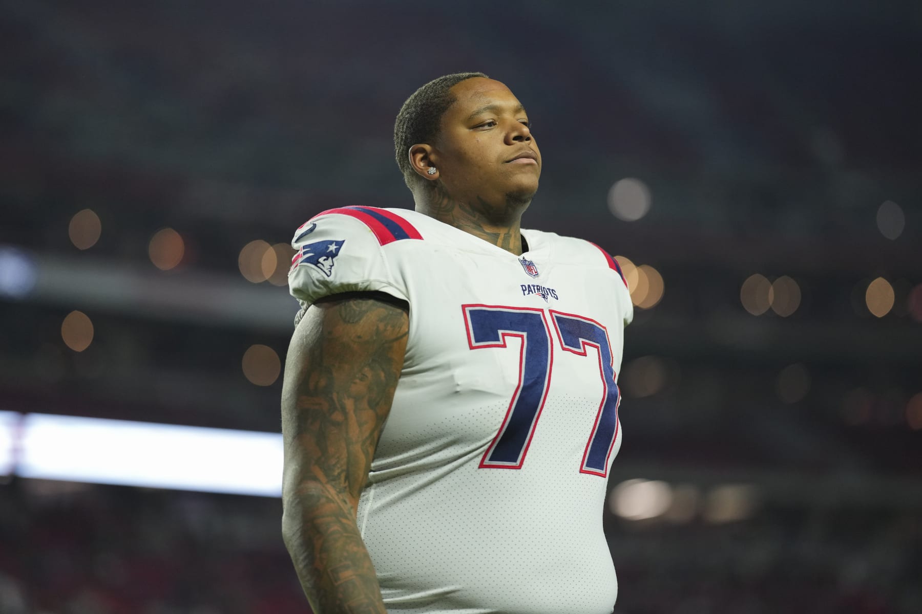 GLENDALE, AZ - DECEMBER 12: Trent Brown #77 of the New England Patriots runs off of the field against the Arizona Cardinals at State Farm Stadium on December 12, 2022 in Glendale, Arizona. (Photo by Cooper Neill/Getty Images)
