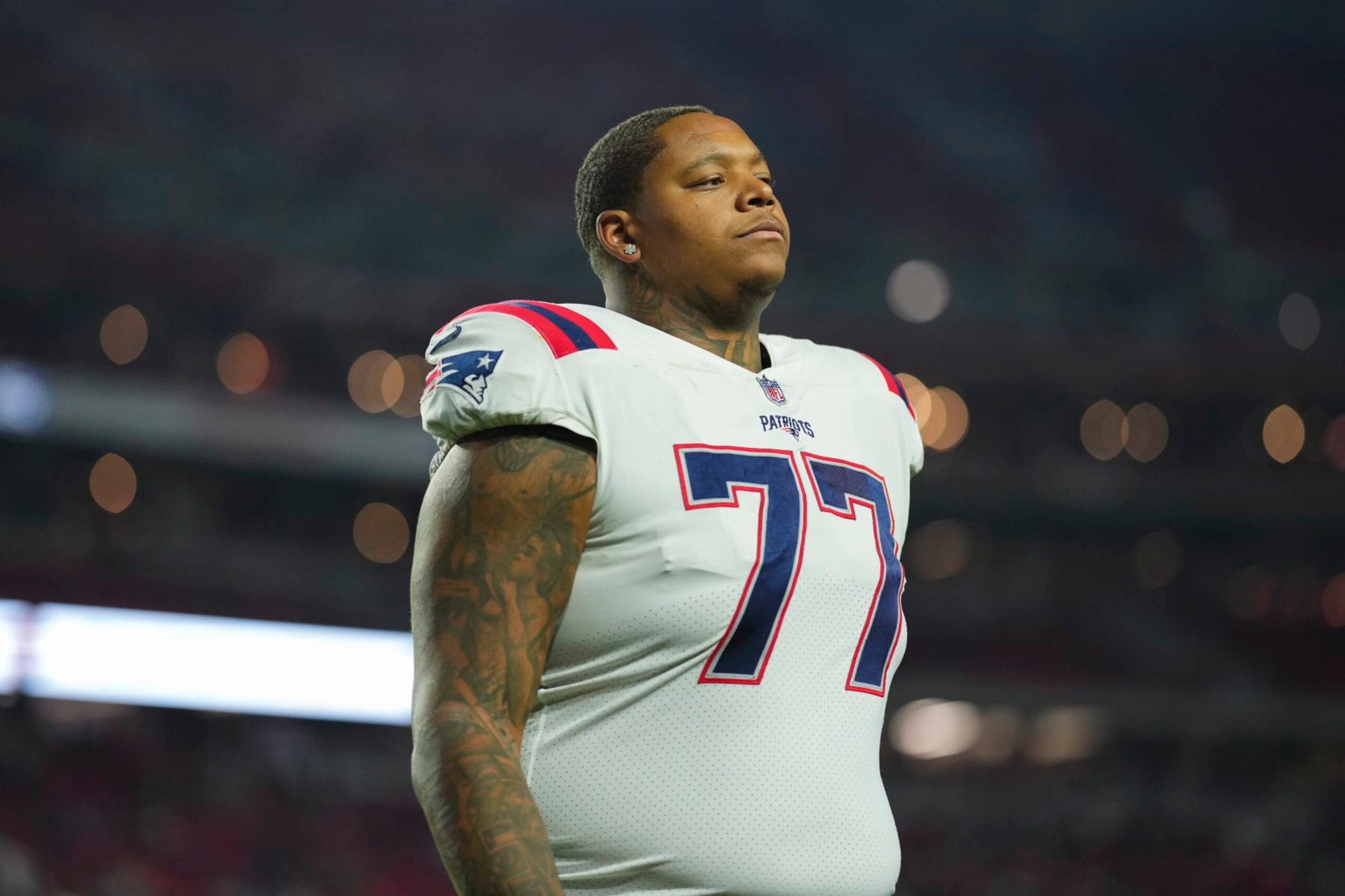 GLENDALE, AZ - DECEMBER 12: Trent Brown #77 of the New England Patriots runs off of the field against the Arizona Cardinals at State Farm Stadium on December 12, 2022 in Glendale, Arizona. (Photo by Cooper Neill/Getty Images)
