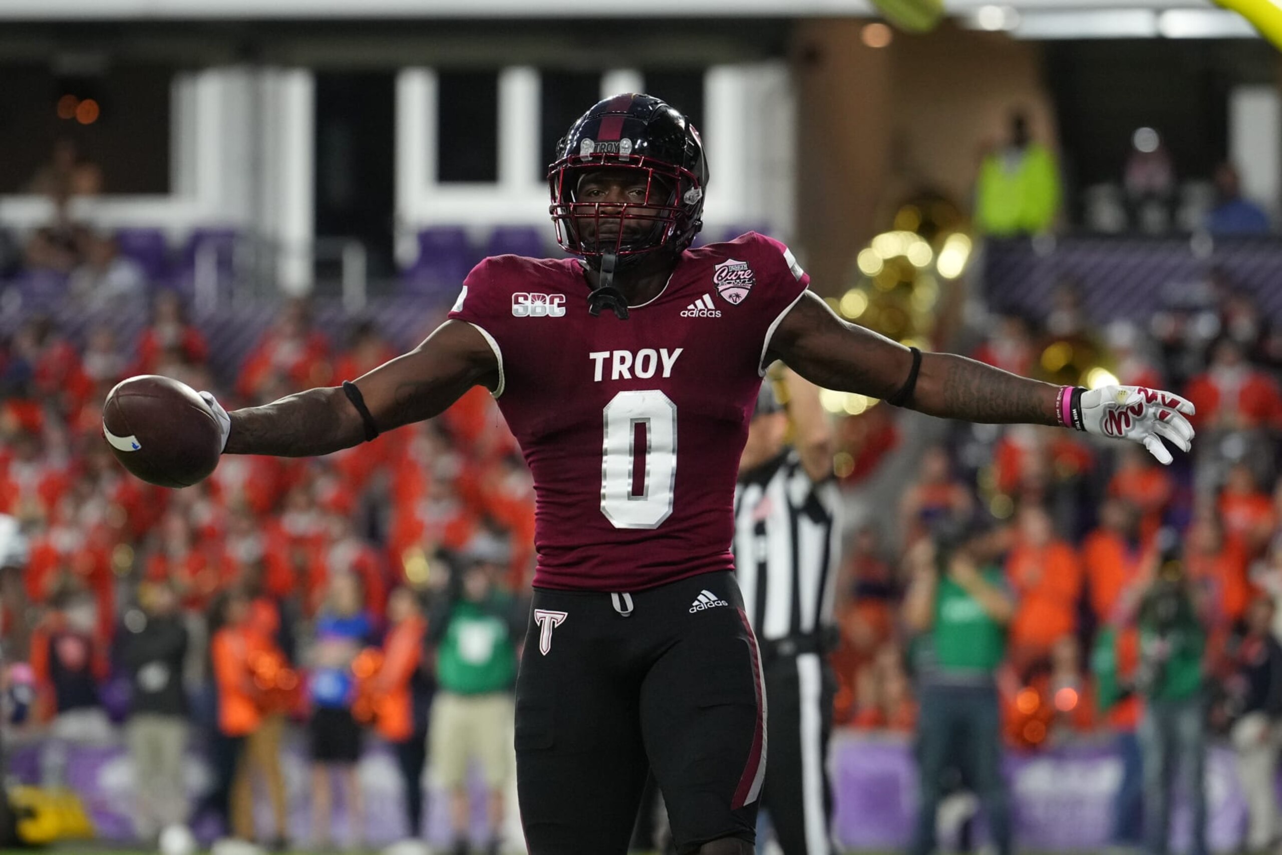 ORLANDO, FL - DECEMBER 16: Troy Trojans wide receiver RaJae' Johnson (0) celebrates his touchdown reception during the game between the UTSA Roadrunners and the Troy Trojans on Friday, December 16, 2022, Duluth Trading Cure Bowl at Exploria Stadium, Orlando, Fla.  (Photo by Peter Joneleit/Icon Sportswire via Getty Images)