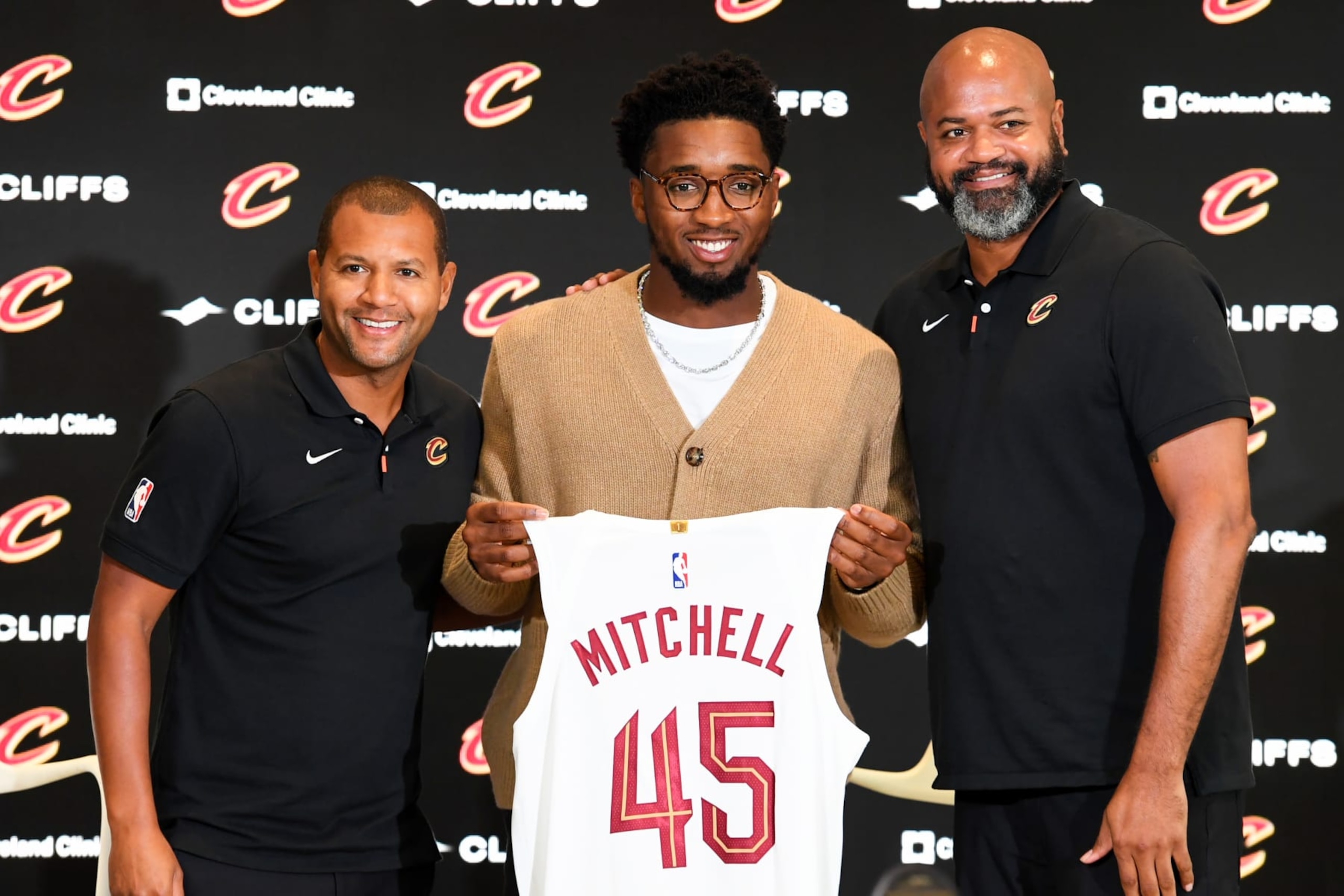 Cleveland Cavaliers executive Koby Altman (left), guard Donovan Mitchell (middle) and head coach J. B. Bickerstaff (right).