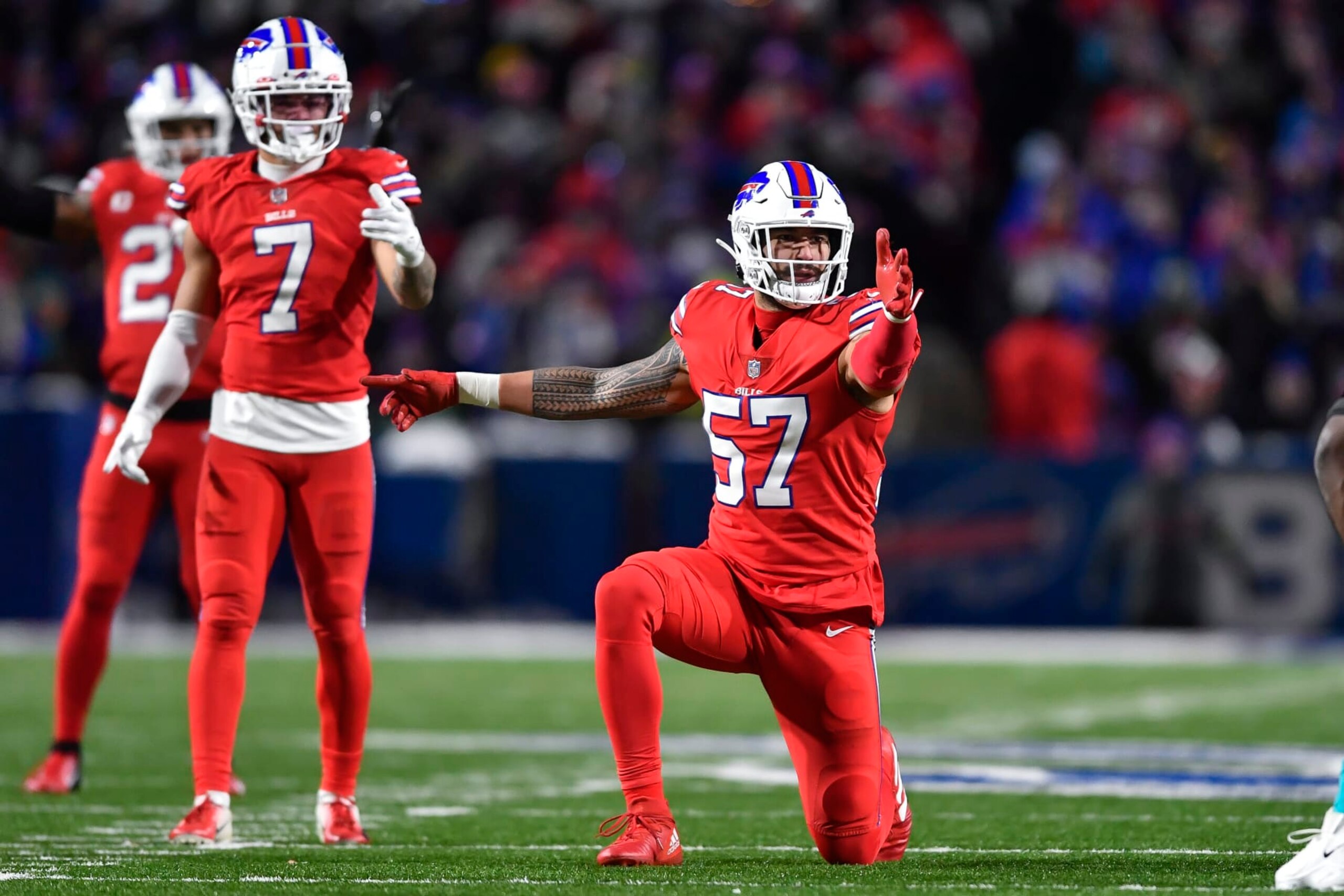 Buffalo Bills defensive end A.J. Epenesa (57) gestures during the second half of an NFL football game against the Miami Dolphins in Orchard Park, N.Y., Saturday, Dec. 17, 2022. (AP Photo/Adrian Kraus)