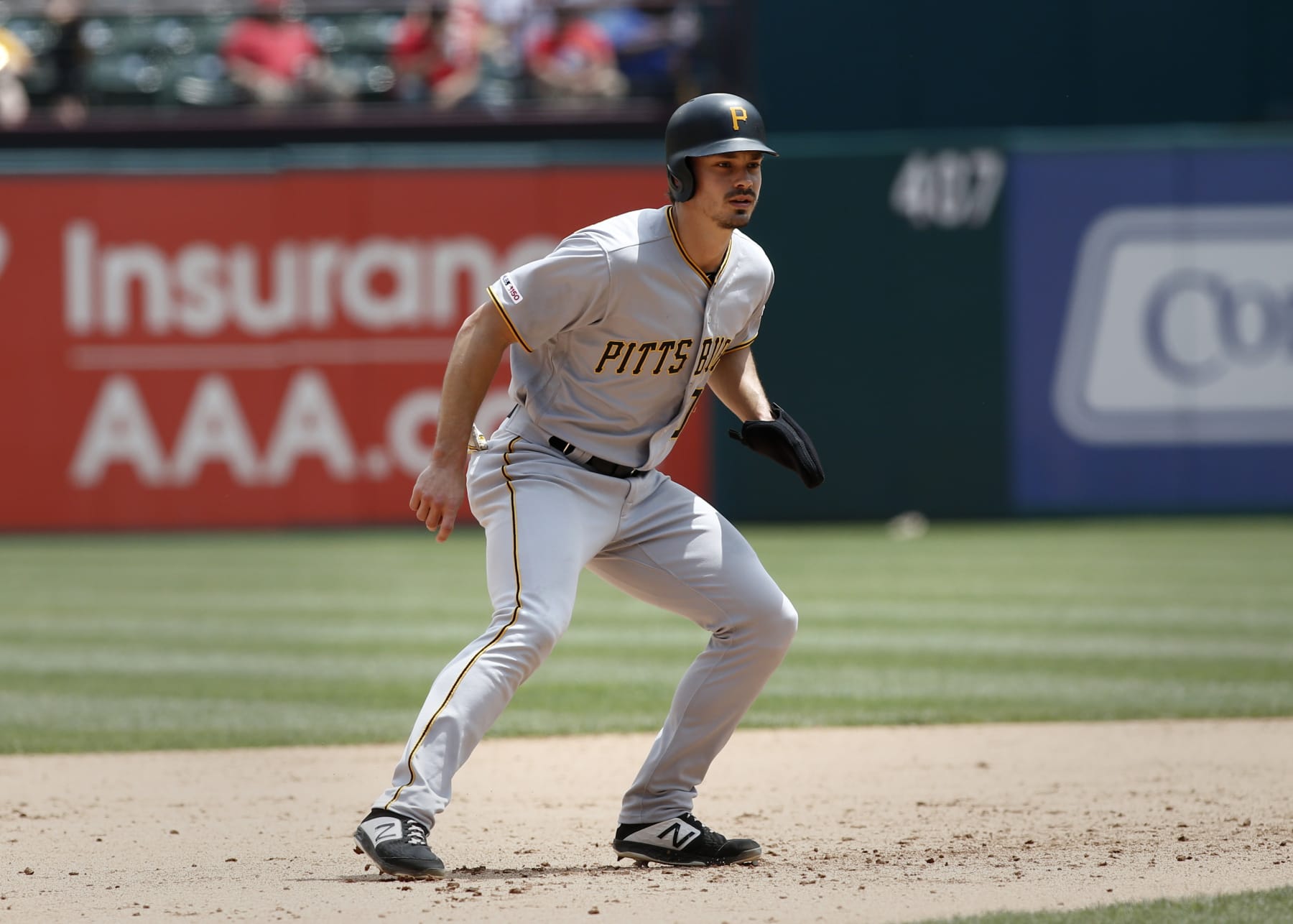 Pittsburgh Pirates' Bryan Reynolds(10) leads off second base against the Texas Rangers during the fourth inning of a baseball game Wednesday May 1, 2019, in Arlington, Texas. Reynolds doubled to drive in three runs. (AP Photo/Mike Stone)