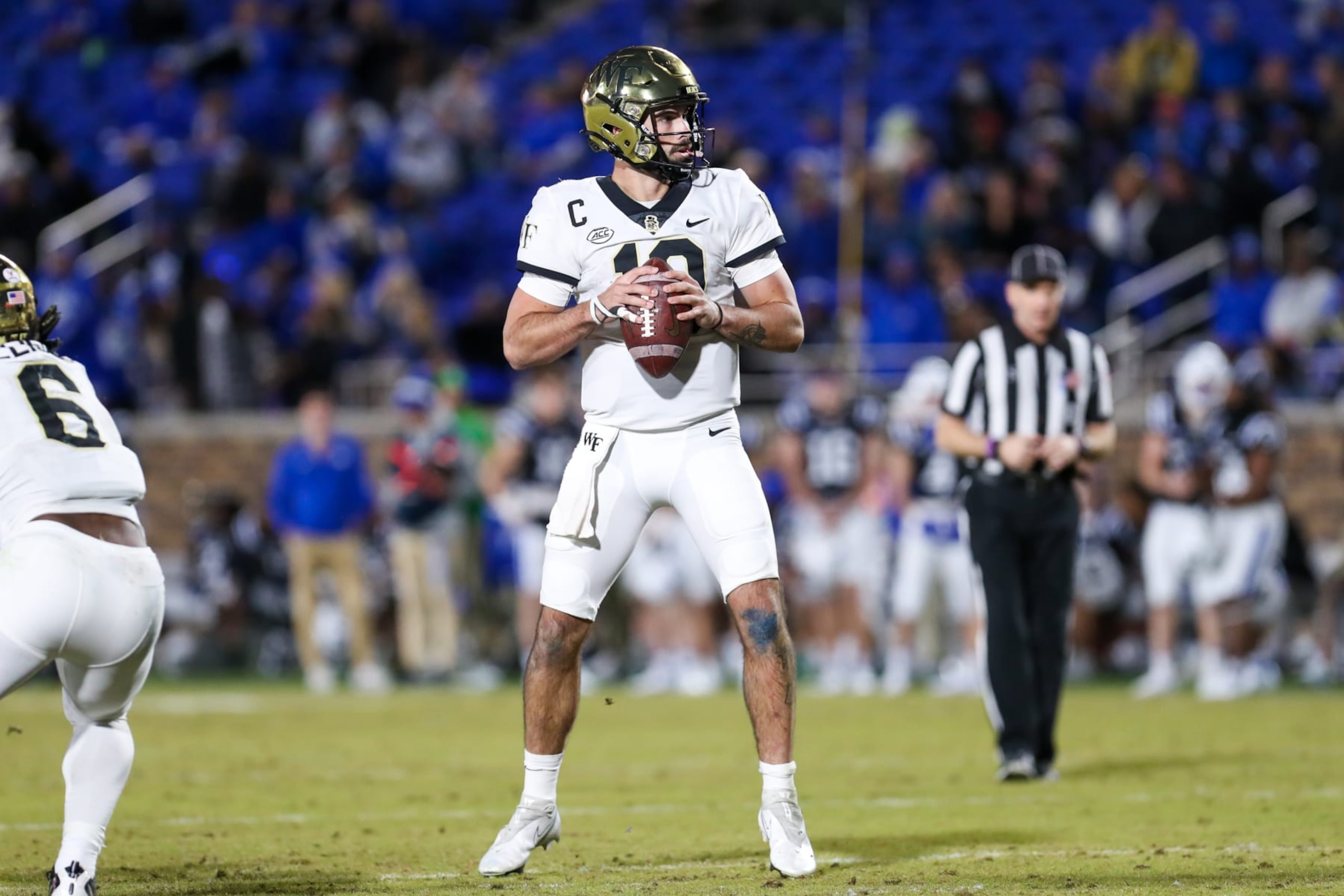 DURHAM, NC - NOVEMBER 26: Sam Hartman (10) of the Wake Forest Demon Deacons looks to pass the ball during a football game between the Duke Blue Devils and the Wake Forest Demon Deacons on Nov 26, 2022 at Wallace Wade Stadium in Durham, NC. (Photo by David Jensen/Icon Sportswire via Getty Images) DURHAM, NC - NOVEMBER 26: Sam Hartman (10) of the Wake Forest Demon Deacons looks to pass the ball during a football game between the Duke Blue Devils and the Wake Forest Demon Deacons on Nov 26, 2022 at Wallace Wade Stadium in Durham, NC. (Photo by David Jensen/Icon Sportswire via Getty Images)