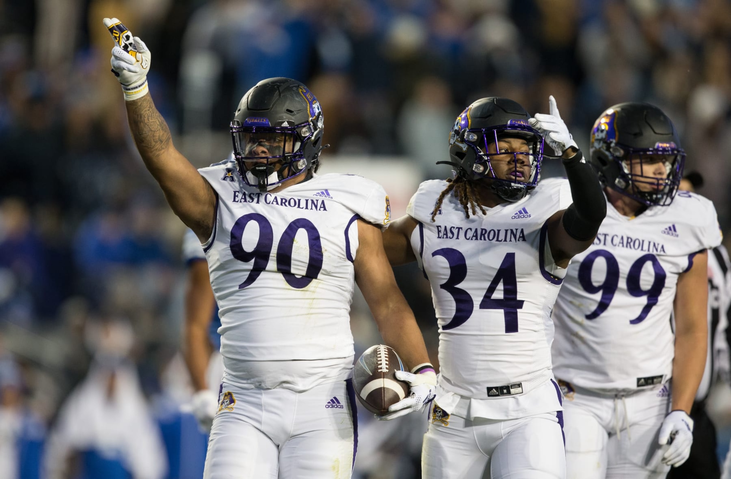 SALT LAKE CITY UT- OCTOBER 28: Elijah Morris #90 of the East Carolina Pirates carries the football as he celebrates recovering a Brigham Young Cougars fumble with teammates Myles Berry #34 and J.D. Lampley #99 during the first half of the game of their game at the LaVell Edwards Stadium October 28, 2022 in Provo, Utah. (Photo by Chris Gardner/ Getty Images) SALT LAKE CITY UT- OCTOBER 28: Elijah Morris #90 of the East Carolina Pirates carries the football as he celebrates recovering a Brigham Young Cougars fumble with teammates Myles Berry #34 and J.D. Lampley #99 during the first half of the game of their game at the LaVell Edwards Stadium October 28, 2022 in Provo, Utah. (Photo by Chris Gardner/ Getty Images)