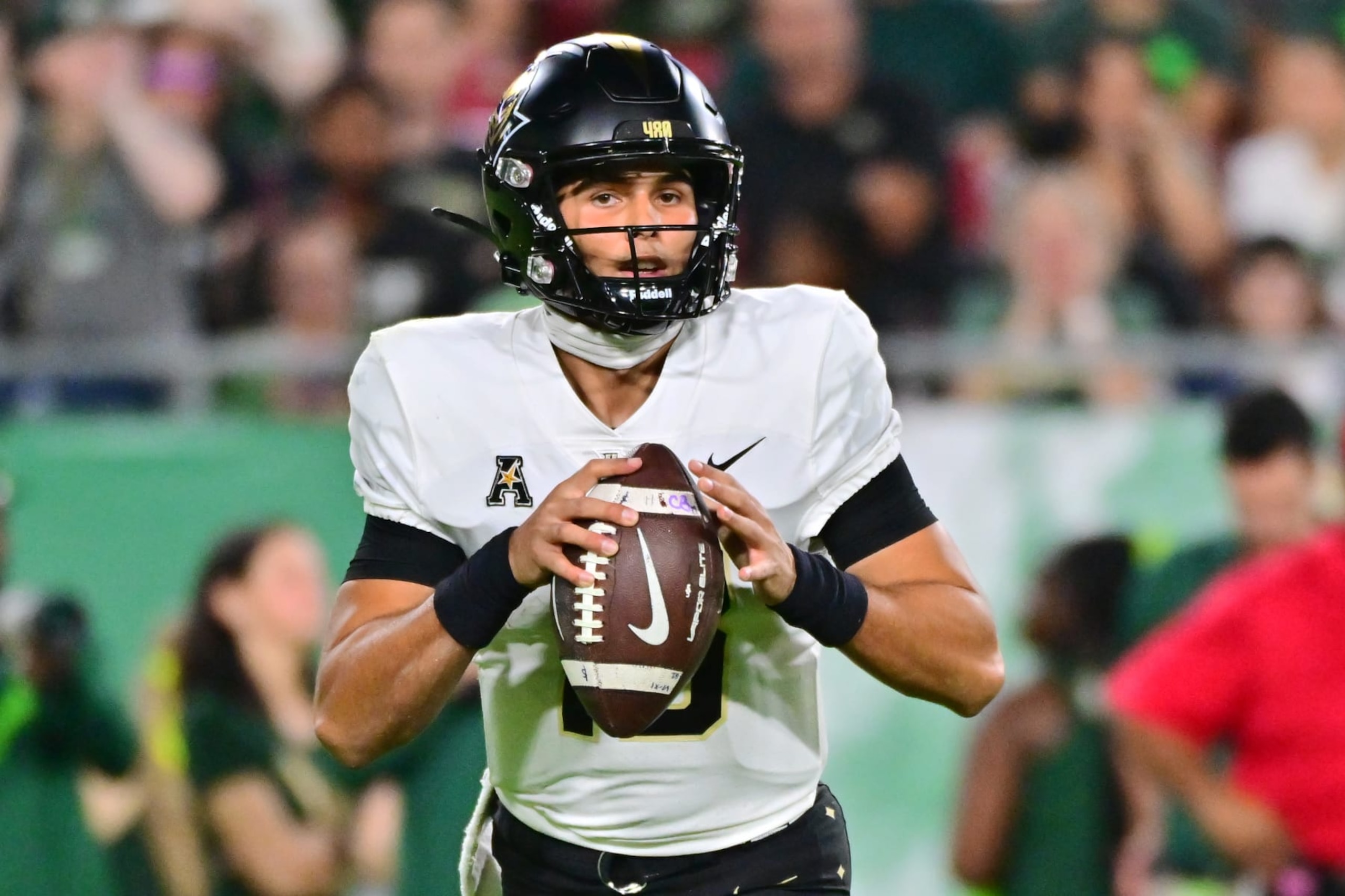 TAMPA, FLORIDA - NOVEMBER 26: Mikey Keene #13 of the UCF Knights drops back to throw a pass in the fourth quarter against the South Florida Bulls at Raymond James Stadium on November 26, 2022 in Tampa, Florida. (Photo by Julio Aguilar/Getty Images) TAMPA, FLORIDA - NOVEMBER 26: Mikey Keene #13 of the UCF Knights drops back to throw a pass in the fourth quarter against the South Florida Bulls at Raymond James Stadium on November 26, 2022 in Tampa, Florida. (Photo by Julio Aguilar/Getty Images)