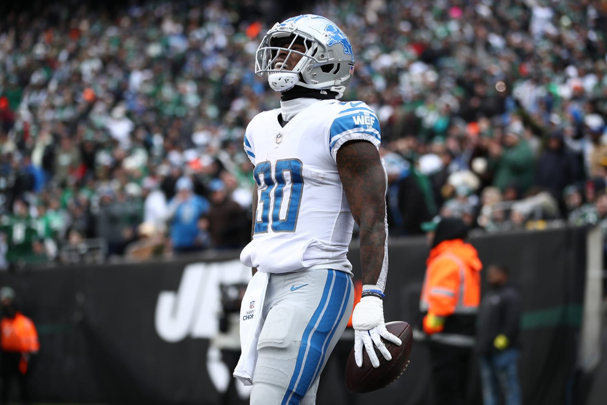 EAST RUTHERFORD, NEW JERSEY - DECEMBER 18: Jamaal Williams #30 of the Detroit Lions celebrates a run that was called back by a penalty during the first half against the New York Jets at MetLife Stadium on December 18, 2022 in East Rutherford, New Jersey. (Photo by Sarah Stier/Getty Images)