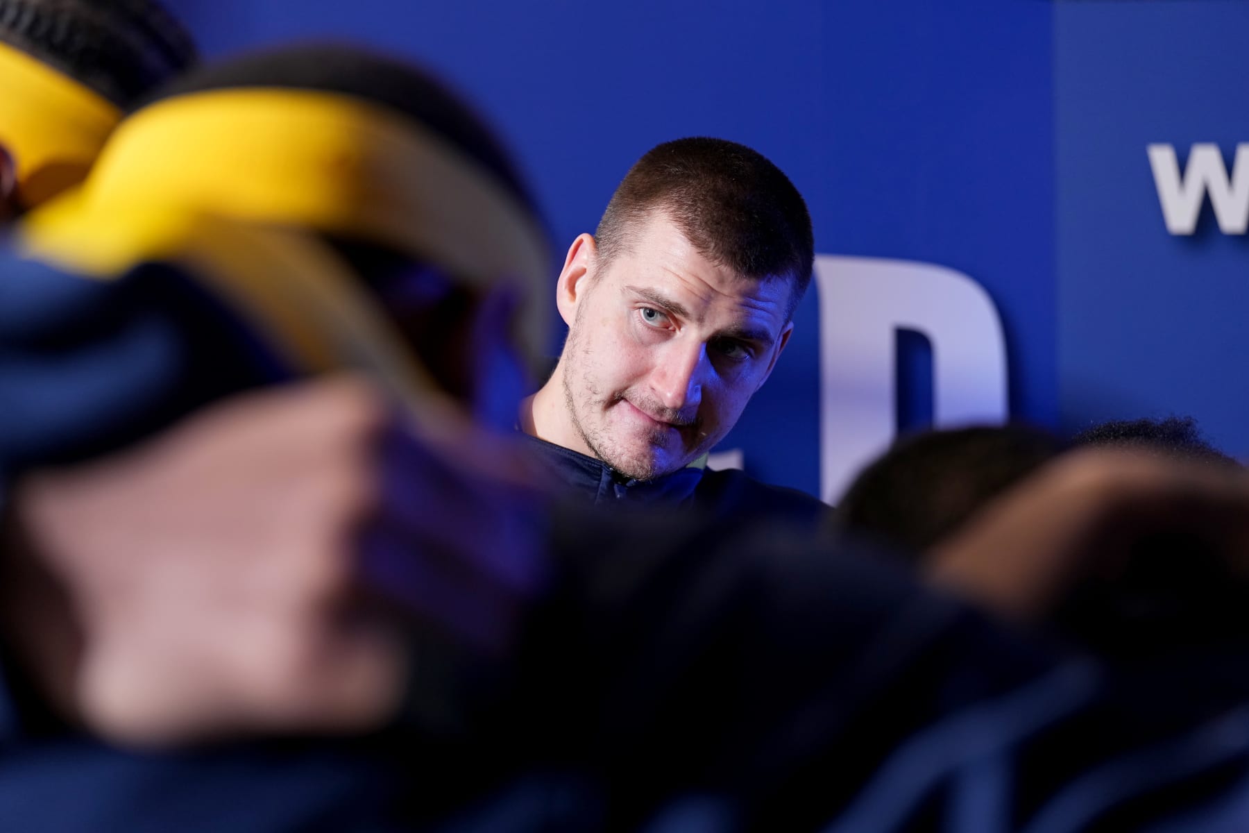 DENVER, CO - DECEMBER 20: Nikola Jokic #15 of the Denver Nuggets looks on before the game against the Memphis Grizzlies on December 20, 2022 at the Ball Arena in Denver, Colorado. NOTE TO USER: User expressly acknowledges and agrees that, by downloading and/or using this Photograph, user is consenting to the terms and conditions of the Getty Images License Agreement. Mandatory Copyright Notice: Copyright 2022 NBAE (Photo by Garrett Ellwood/NBAE via Getty Images)