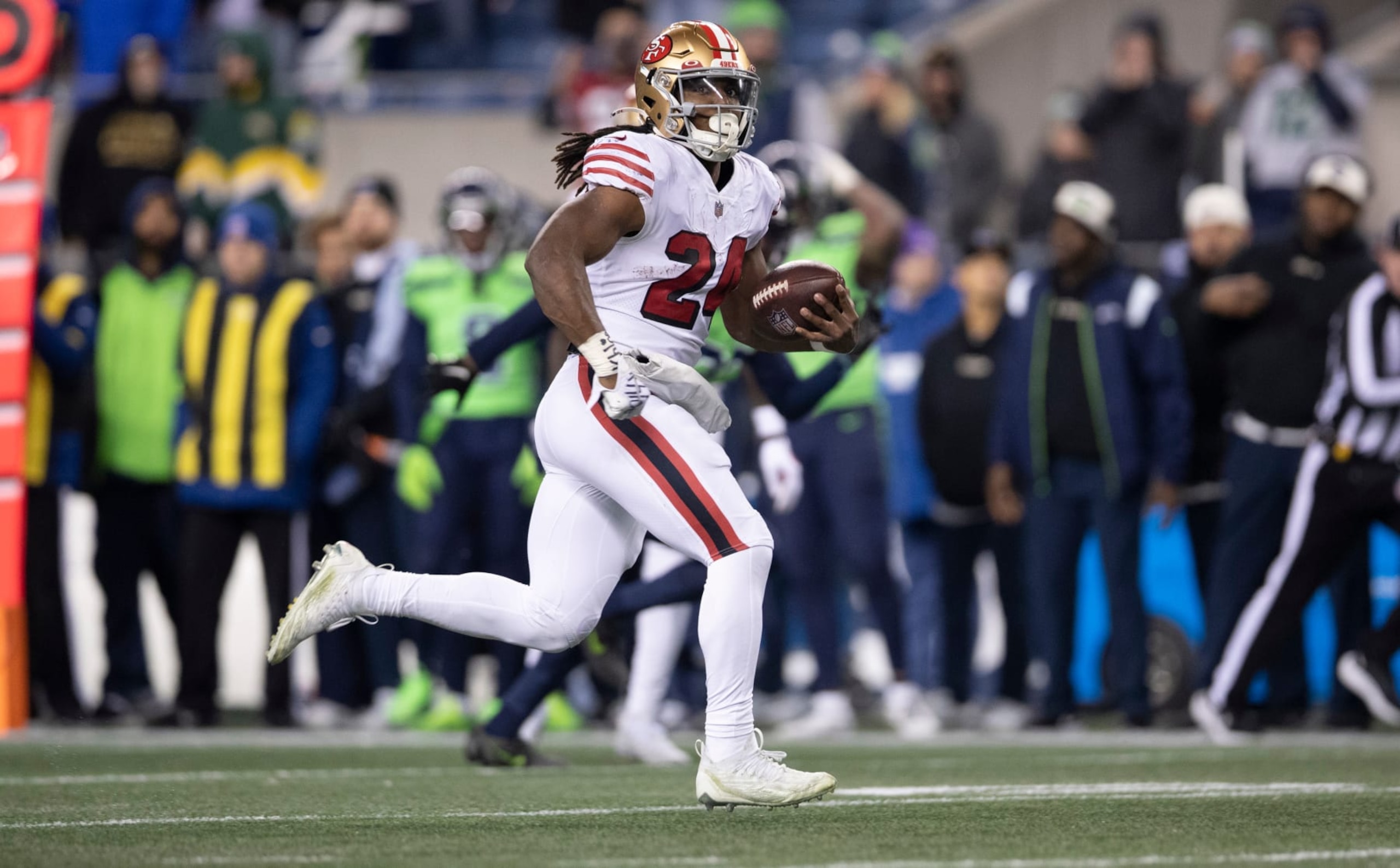 SEATTLE, WA - DECEMBER 15: Jordan Mason #24 of the San Francisco 49ers rushes during the game against the Seattle Seahawks at Lumen Field on December 15, 2022 in Seattle, Washington. The 49ers defeated the Seahawks 21-13. (Photo by Michael Zagaris/San Francisco 49ers/Getty Images)