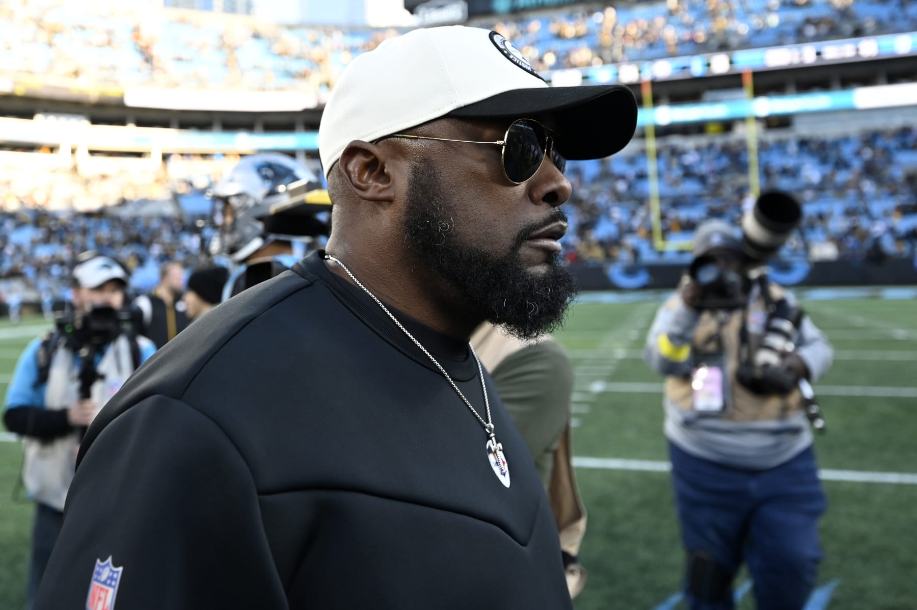 CHARLOTTE, NORTH CAROLINA - DECEMBER 18: Head coach Mike Tomlin of the Pittsburgh Steelers walks on the field after their win over the Carolina Panthers at Bank of America Stadium on December 18, 2022 in Charlotte, North Carolina. (Photo by Eakin Howard/Getty Images)