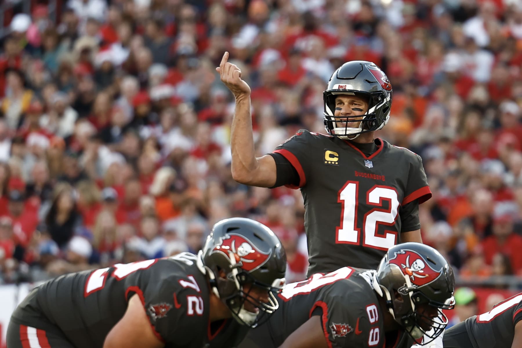 TAMPA, FLORIDA - DECEMBER 18: Tom Brady #12 of the Tampa Bay Buccaneers reacts against the Cincinnati Bengals during the first quarter at Raymond James Stadium on December 18, 2022 in Tampa, Florida. (Photo by Douglas P. DeFelice/Getty Images)