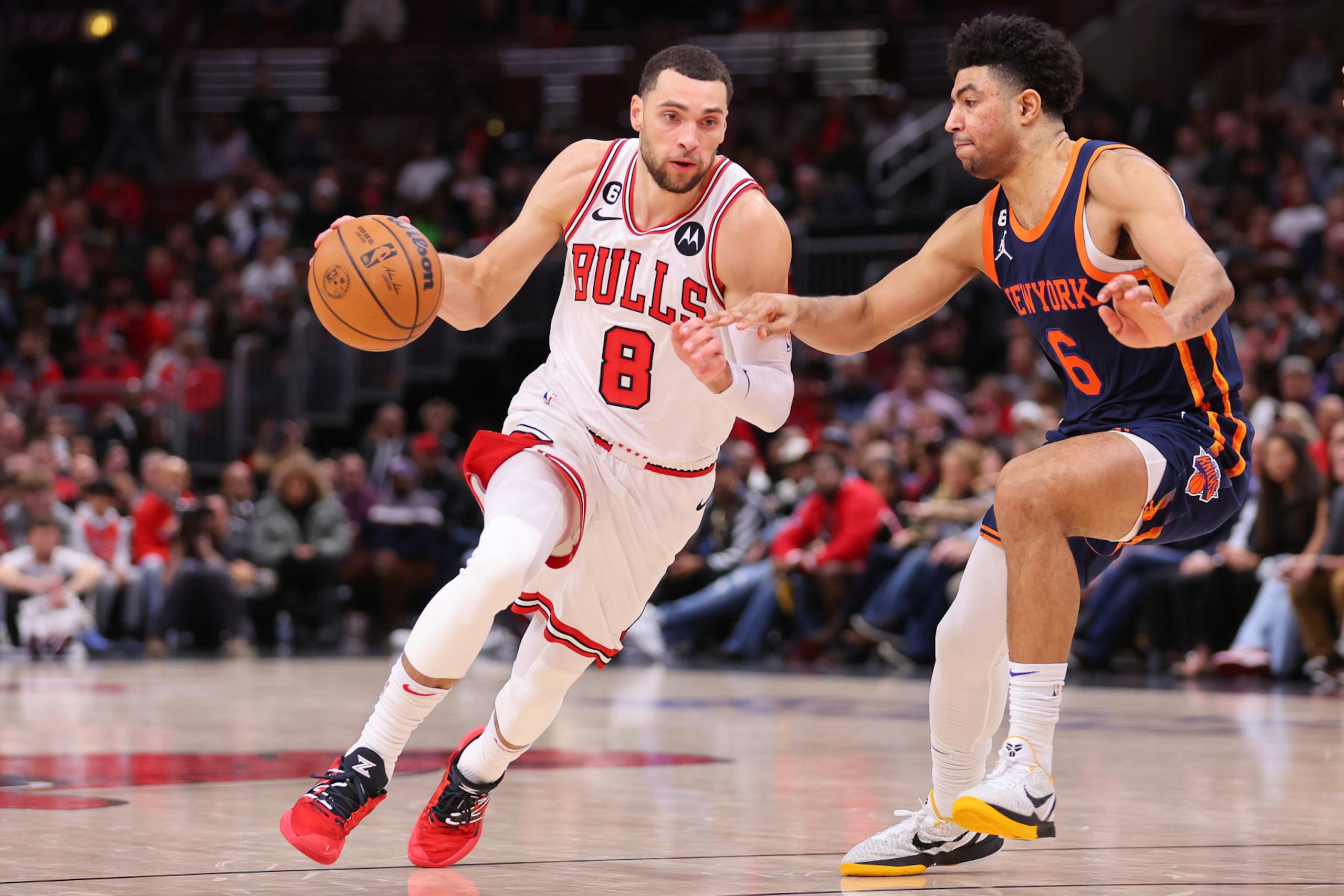 CHICAGO, ILLINOIS - DECEMBER 14: Zach LaVine #8 of the Chicago Bulls drives to the basket against Quentin Grimes #6 of the New York Knicks during the second half at United Center on December 14, 2022 in Chicago, Illinois. NOTE TO USER: User expressly acknowledges and agrees that, by downloading and or using this photograph, User is consenting to the terms and conditions of the Getty Images License Agreement. (Photo by Michael Reaves/Getty Images) CHICAGO, ILLINOIS - DECEMBER 14: Zach LaVine #8 of the Chicago Bulls drives to the basket against Quentin Grimes #6 of the New York Knicks during the second half at United Center on December 14, 2022 in Chicago, Illinois. NOTE TO USER: User expressly acknowledges and agrees that, by downloading and or using this photograph, User is consenting to the terms and conditions of the Getty Images License Agreement. (Photo by Michael Reaves/Getty Images)