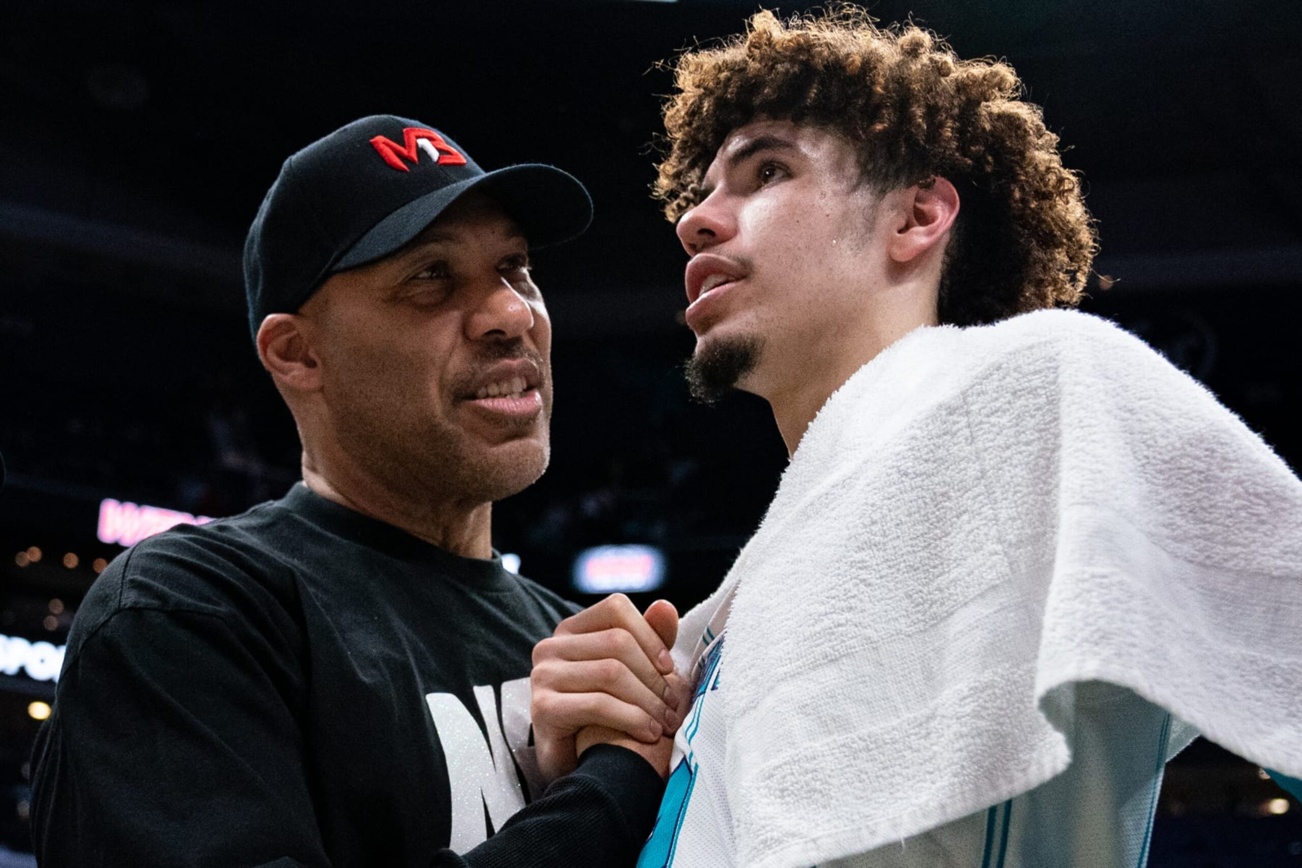 CHARLOTTE, NORTH CAROLINA - MARCH 09: (L-R) LaVar Ball talks with LaMelo Ball #2 of the Charlotte Hornets after their game against the Boston Celtics at Spectrum Center on March 09, 2022 in Charlotte, North Carolina. NOTE TO USER: User expressly acknowledges and agrees that, by downloading and or using this photograph, User is consenting to the terms and conditions of the Getty Images License Agreement. (Photo by Jacob Kupferman/Getty Images)