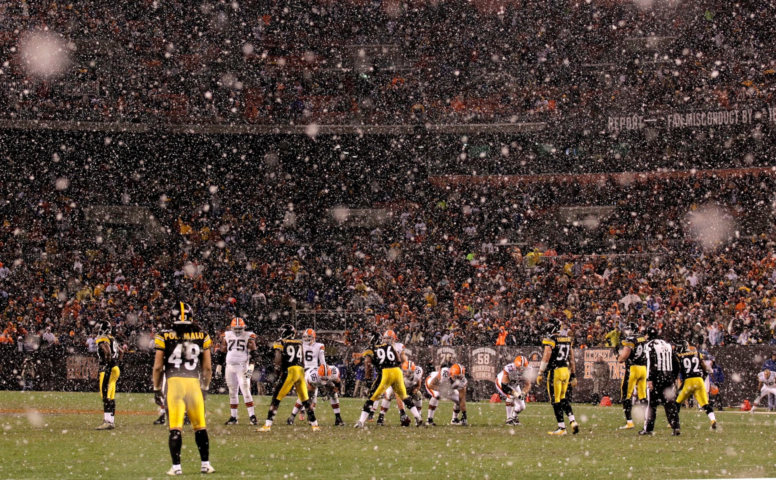 As the snow falls, the Cleveland Browns line up on offense against the Pittsburgh Steelers late in the fourth quarter of their NFL football game on Sunday, Jan. 1, 2012, in Cleveland. The Steelers won the game 13-9. (AP Photo/Amy Sancetta)