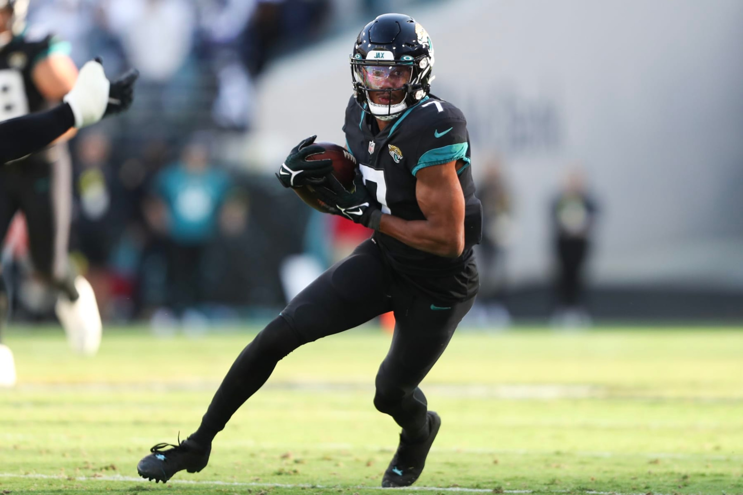 JACKSONVILLE, FLORIDA - DECEMBER 18: Zay Jones #7 of the Jacksonville Jaguars carries the ball during the second half against the Dallas Cowboys at TIAA Bank Field on December 18, 2022 in Jacksonville, Florida. (Photo by Courtney Culbreath/Getty Images)