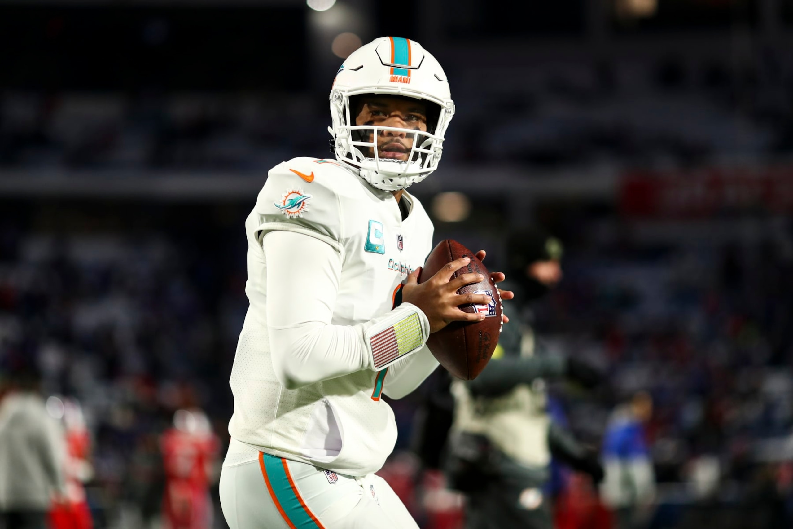 ORCHARD PARK, NY - DECEMBER 17: Tua Tagovailoa #1 of the Miami Dolphins warms up prior to an NFL football game against the Buffalo Bills at Highmark Stadium on December 17, 2022 in Orchard Park, New York. (Photo by Kevin Sabitus/Getty Images)