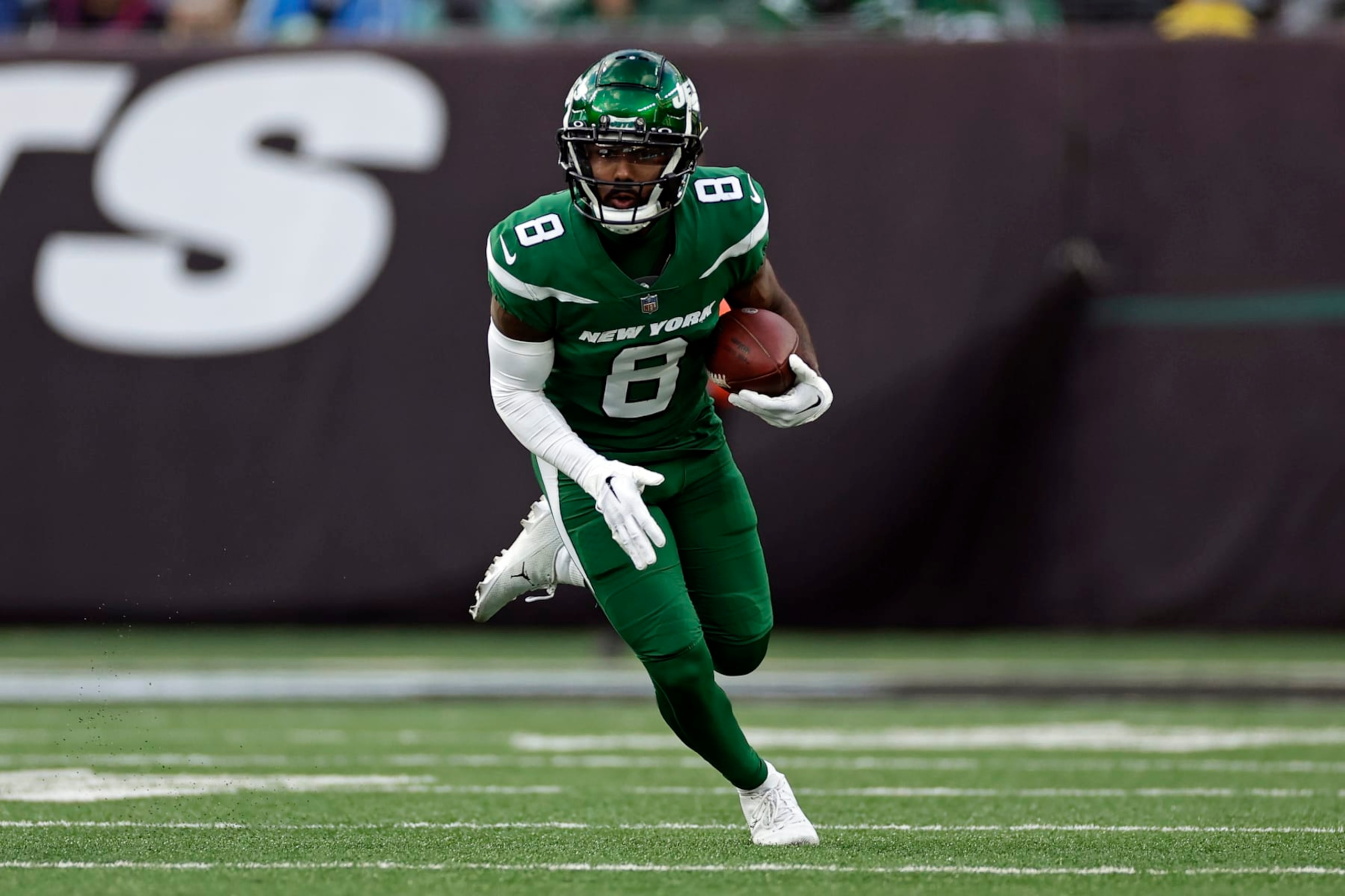 New York Jets wide receiver Elijah Moore (8) runs with the ball against the Detroit Lions during an NFL football game Sunday, Dec. 18, 2022, in East Rutherford, N.J. (AP Photo/Adam Hunger)