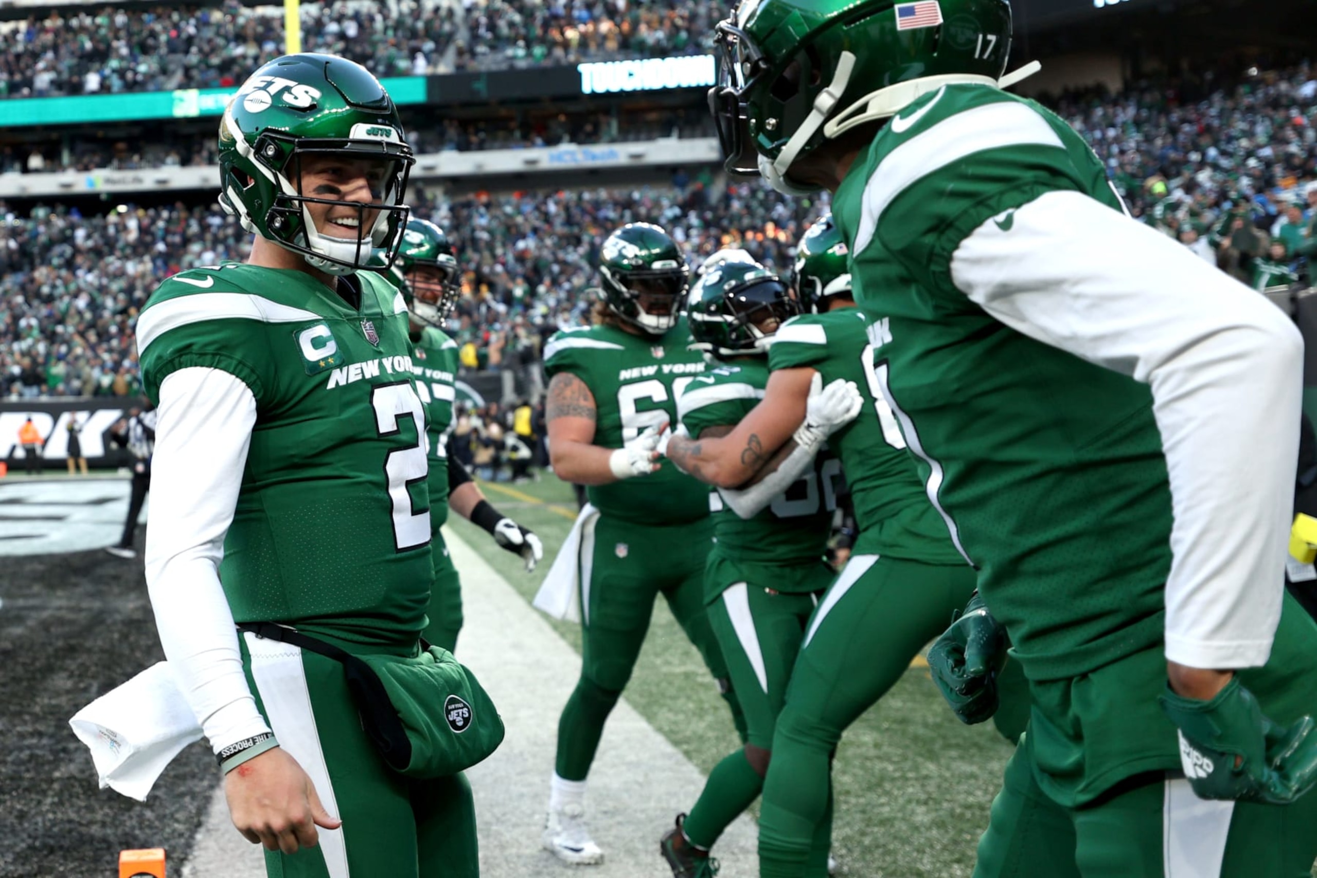 EAST RUTHERFORD, NEW JERSEY - DECEMBER 18: Zach Wilson #2 of the New York Jets celebrates a touchdown during the fourth quarter against the Detroit Lions at MetLife Stadium on December 18, 2022 in East Rutherford, New Jersey. (Photo by Sarah Stier/Getty Images)