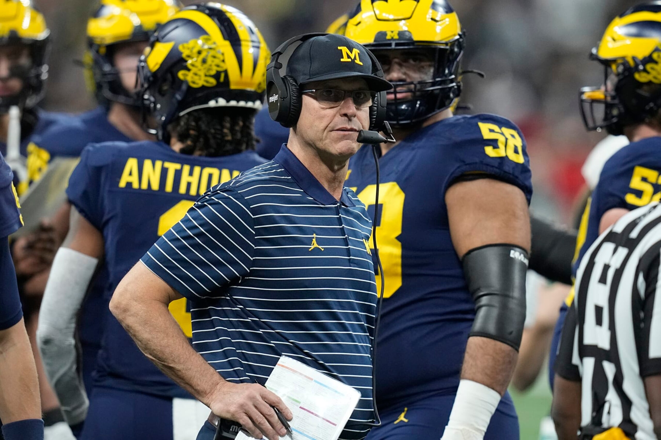 Michigan head coach Jim Harbaugh watches from the sidelines during the first half of the Big Ten championship NCAA college football game against Purdue, Saturday, Dec. 3, 2022, in Indianapolis. (AP Photo/Darron Cummings)
