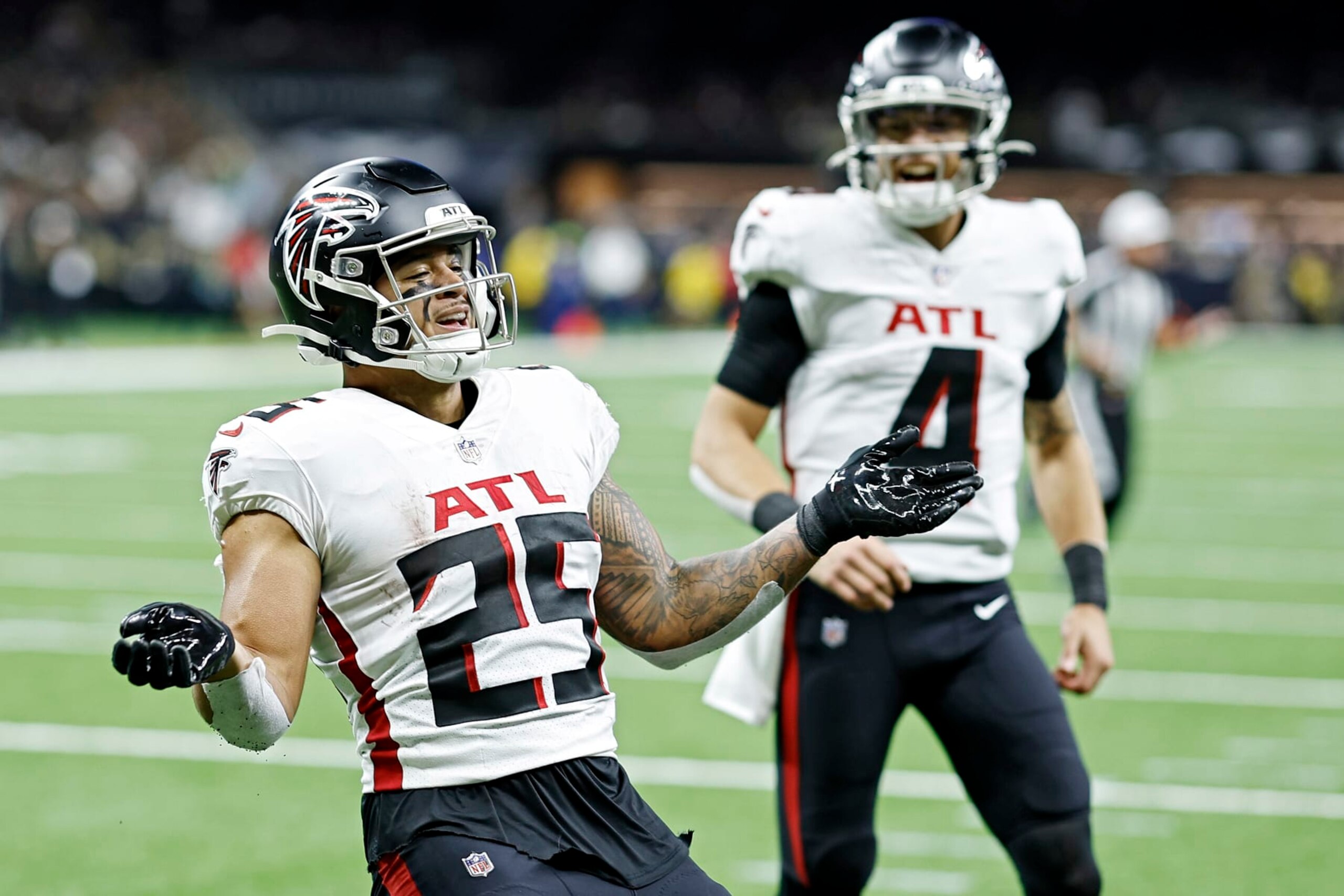 NEW ORLEANS, LOUISIANA - DECEMBER 18: Tyler Allgeier #25 of the Atlanta Falcons celebrates a touchdown during the third quarter in the game against the New Orleans Saints at Caesars Superdome on December 18, 2022 in New Orleans, Louisiana. (Photo by Chris Graythen/Getty Images)