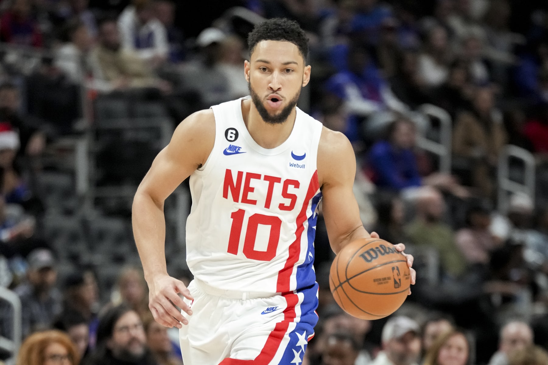 DETROIT, MICHIGAN - DECEMBER 18: Ben Simmons #10 of the Brooklyn Nets handles the ball against the Detroit Pistons at Little Caesars Arena on December 18, 2022 in Detroit, Michigan. NOTE TO USER: User expressly acknowledges and agrees that, by downloading and or using this photograph, User is consenting to the terms and conditions of the Getty Images License Agreement. (Photo by Nic Antaya/Getty Images)