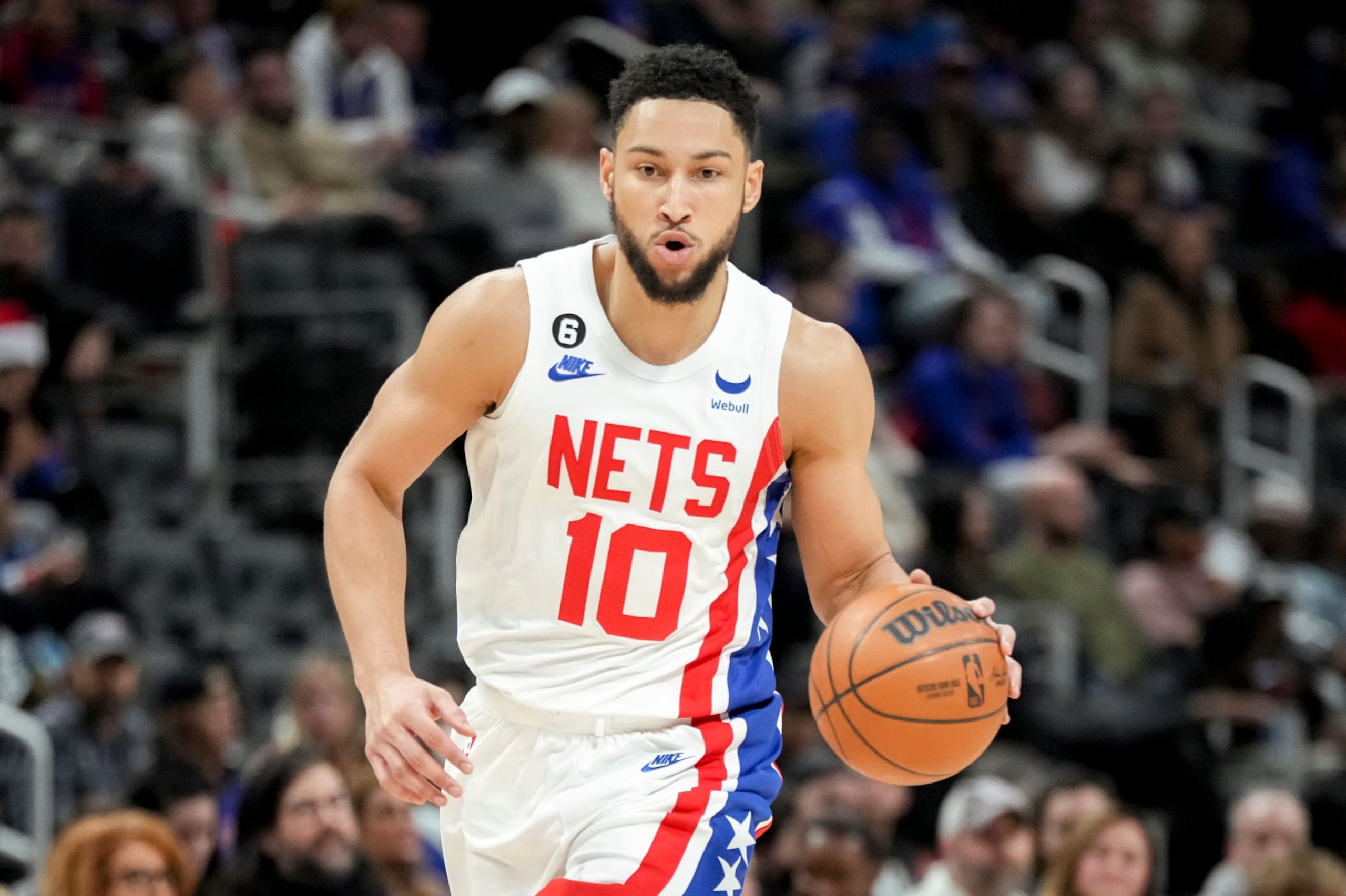 DETROIT, MICHIGAN - DECEMBER 18: Ben Simmons #10 of the Brooklyn Nets handles the ball against the Detroit Pistons at Little Caesars Arena on December 18, 2022 in Detroit, Michigan. NOTE TO USER: User expressly acknowledges and agrees that, by downloading and or using this photograph, User is consenting to the terms and conditions of the Getty Images License Agreement. (Photo by Nic Antaya/Getty Images)