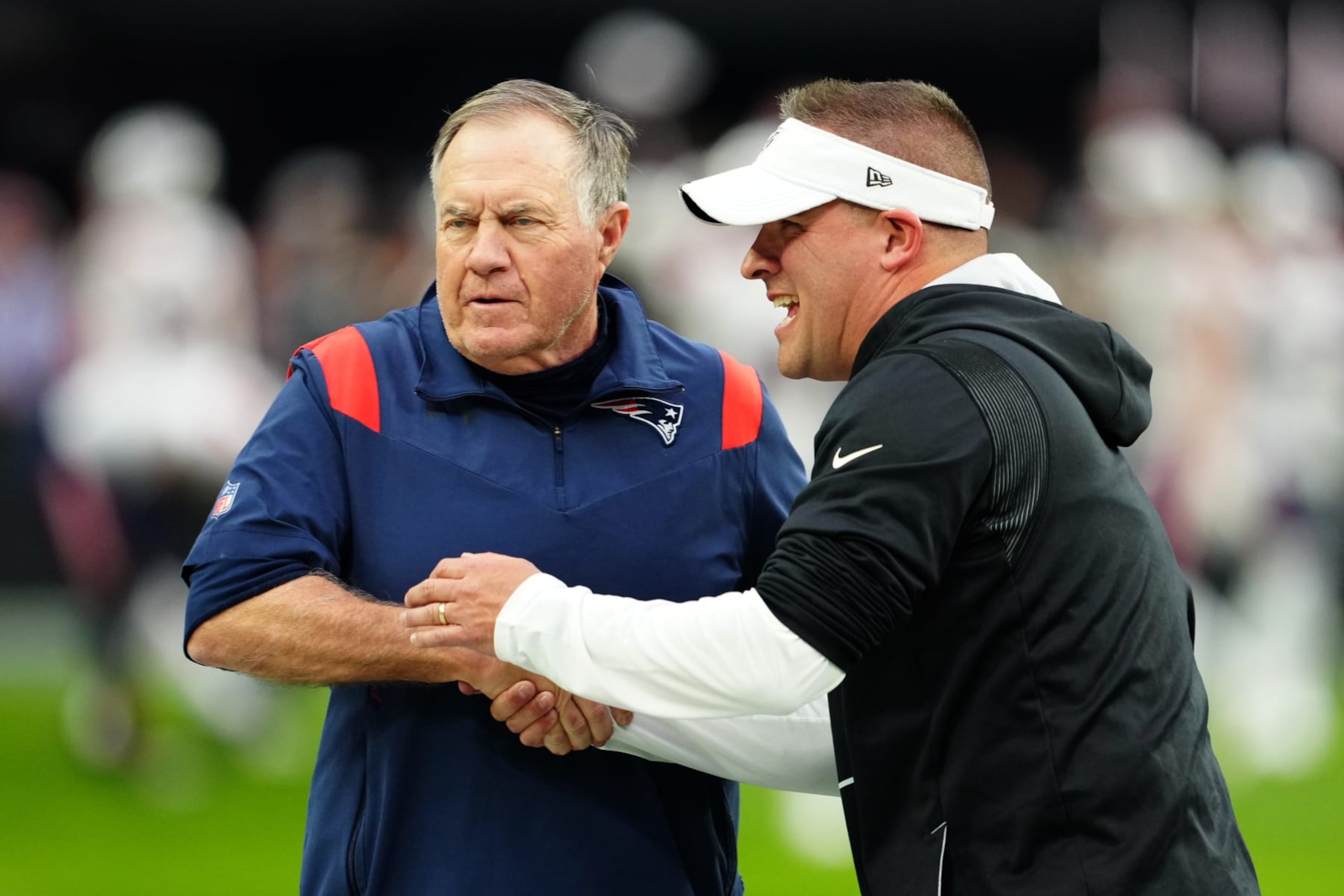 LAS VEGAS, NEVADA - chick of the New England Patriots DECEMBER 18: Head coach Bill Belichick of the New England Patriots and head coach Josh McDaniels of the Las Vegas Raiders talk before a game at Allegiant Stadium on December 18, 2022 in Las Vegas, Nevada. (Photo by Jeff Bottari/Getty Images) LAS VEGAS, NEVADA - chick of the New England Patriots DECEMBER 18: Head coach Bill Belichick of the New England Patriots and head coach Josh McDaniels of the Las Vegas Raiders talk before a game at Allegiant Stadium on December 18, 2022 in Las Vegas, Nevada. (Photo by Jeff Bottari/Getty Images)