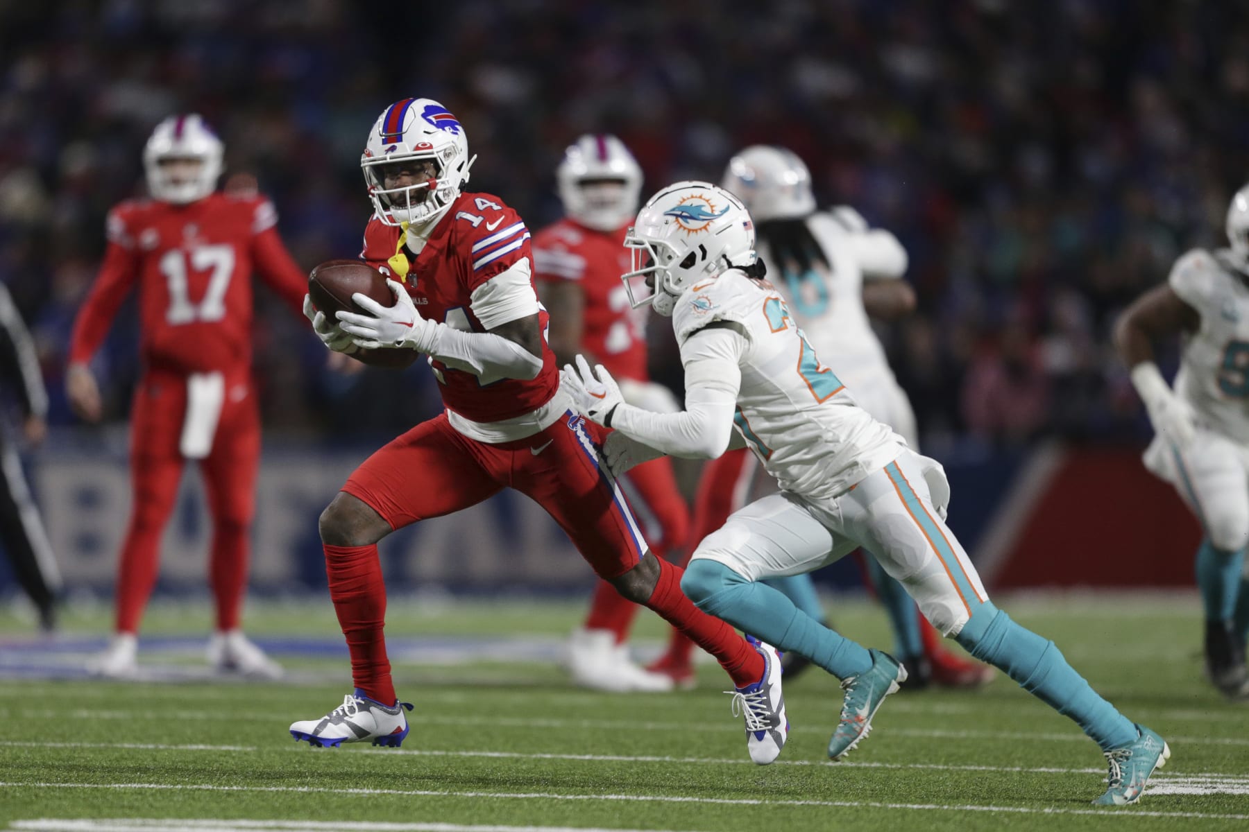 Buffalo Bills wide receiver Stefon Diggs (14) runs after a catch during the first half of an NFL football game against the Miami Dolphins on Saturday, Dec. 17, 2022, in Orchard Park, N.Y. (AP Photo/Joshua Bessex)
