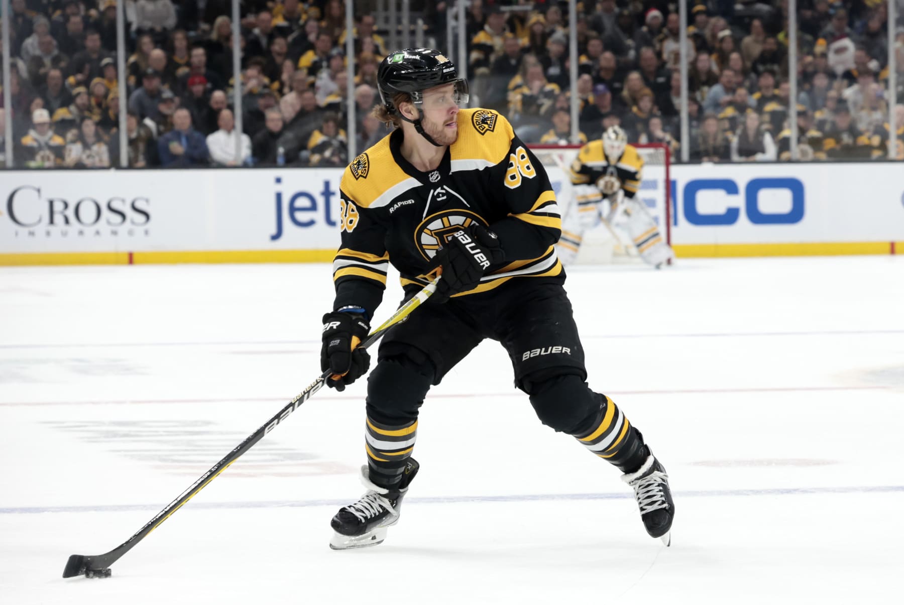 BOSTON, MA - DECEMBER 19: Boston Bruins right wing David Pastrnak (88) holds the puck on the power play during a game between the Boston Bruins and the Florida Panthers on December 19, 2022, at TD Garden in Boston, Massachusetts. (Photo by Fred Kfoury III/Icon Sportswire via Getty Images)