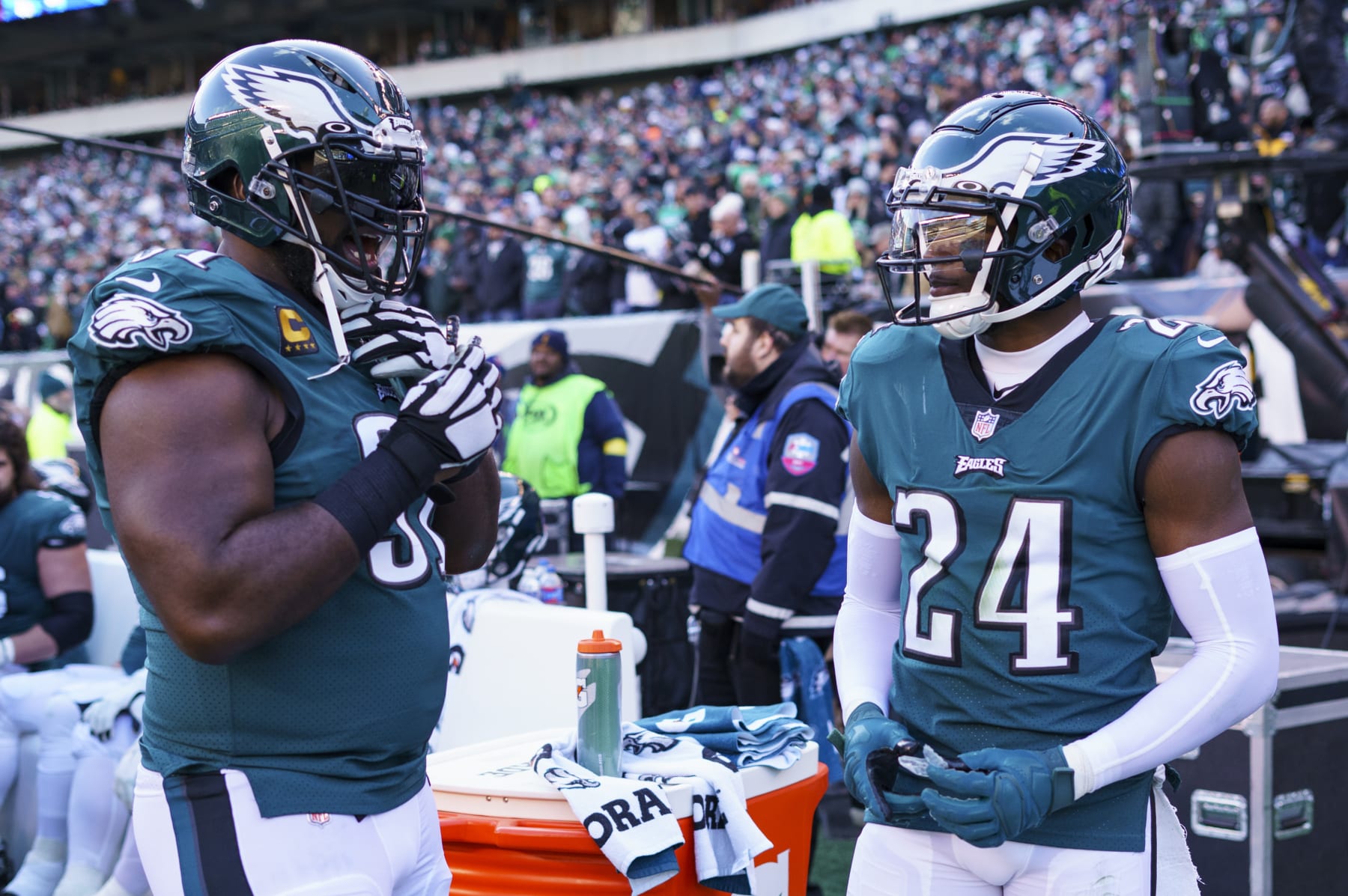 Philadelphia Eagles defensive end Fletcher Cox (91) talks with cornerback James Bradberry (24) during the NFL football game against the Tennessee Titans, Sunday, Dec. 4, 2022, in Philadelphia. (AP Photo/Chris Szagola)