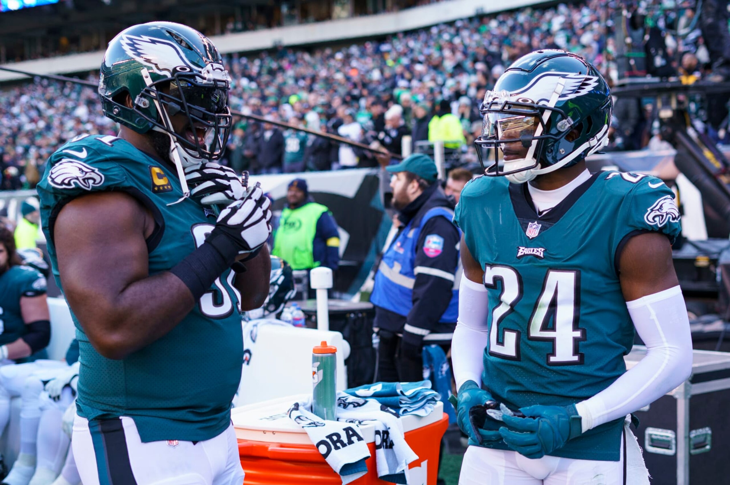 Philadelphia Eagles defensive end Fletcher Cox (91) talks with cornerback James Bradberry (24) during the NFL football game against the Tennessee Titans, Sunday, Dec. 4, 2022, in Philadelphia. (AP Photo/Chris Szagola)