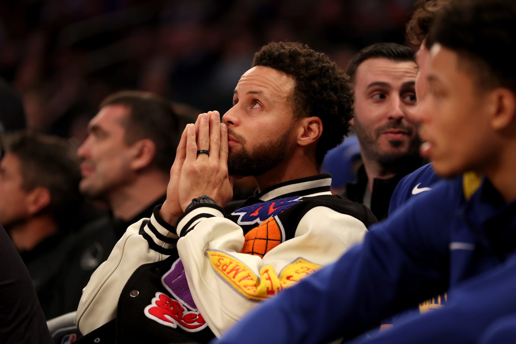 NEW YORK, NEW YORK - DECEMBER 20: Stephen Curry #30 of the Golden State Warriors looks on from the bench during the second quarter of the game against the New York Knicks at Madison Square Garden on December 20, 2022 in New York City. NOTE TO USER: User expressly acknowledges and agrees that, by downloading and/or using this photograph, User is consenting to the terms and conditions of the Getty Images License Agreement. (Photo by Sarah Stier/Getty Images)