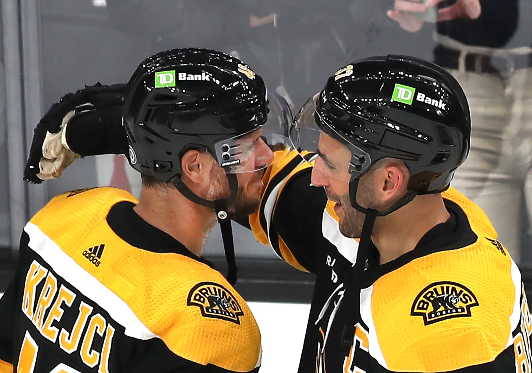 Boston, MA - October 1: Boston Bruins David Krejci, left, is hugged by Patrice Bergeron. The Bruins beat the Philadelphia Flyers, 4-0. (Photo by John Tlumacki/The Boston Globe via Getty Images)