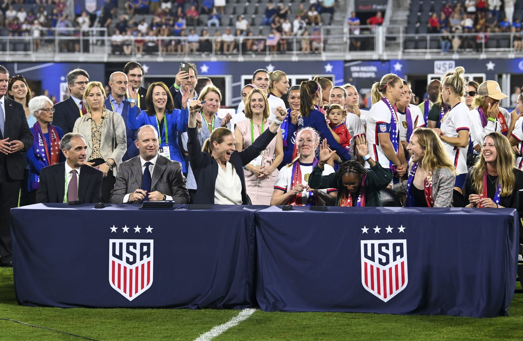 WASHINGTON, DC - SEPTEMBER 6:  Participants rejoice after during signing ceremony for the historic new Collective Bargaining Agreements for equal pay for Women athletes at Audi Field (Photo by Jonathan Newton/The Washington Post via Getty Images)