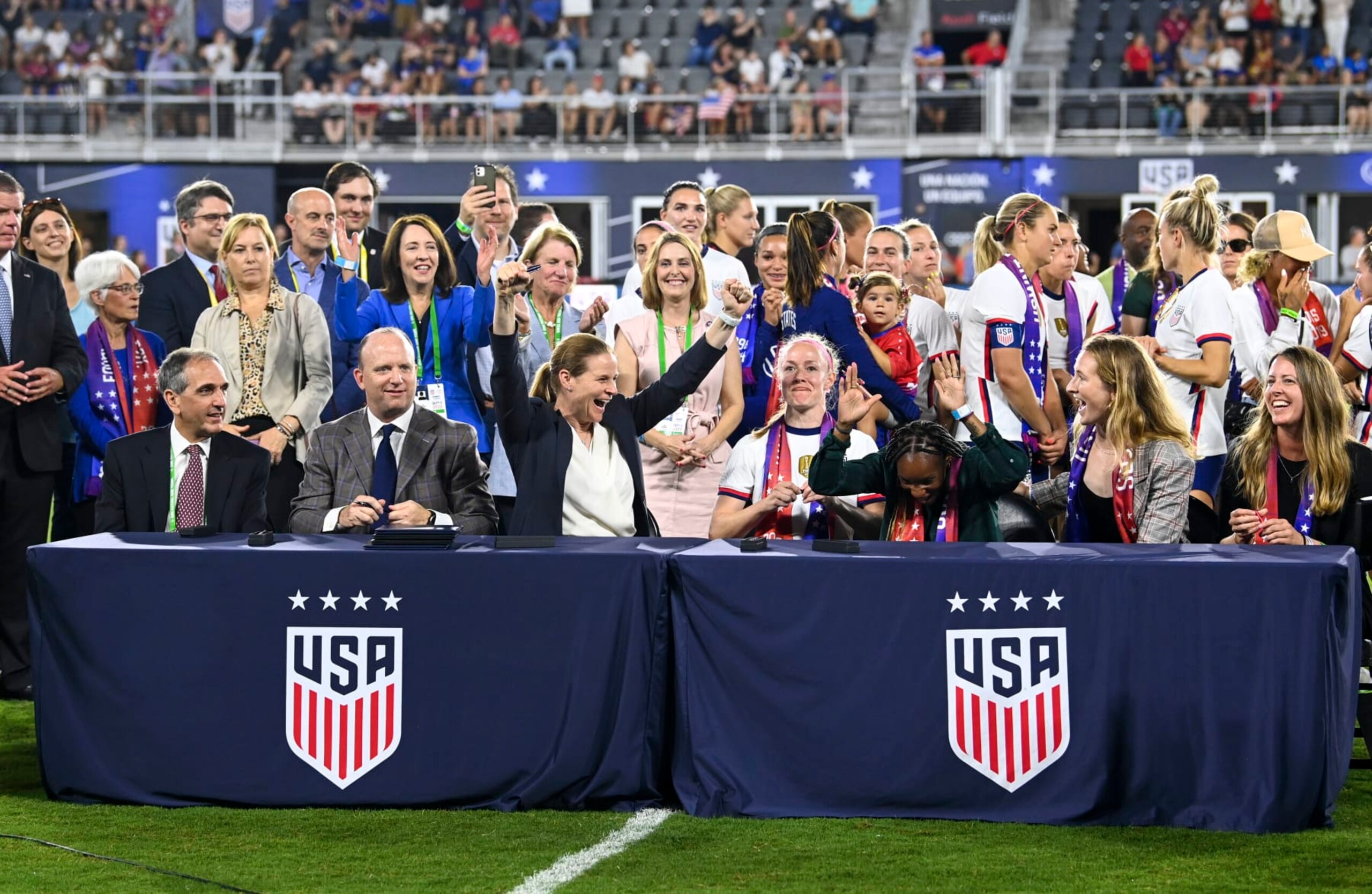 WASHINGTON, DC - SEPTEMBER 6:  Participants rejoice after during signing ceremony for the historic new Collective Bargaining Agreements for equal pay for Women athletes at Audi Field (Photo by Jonathan Newton/The Washington Post via Getty Images)