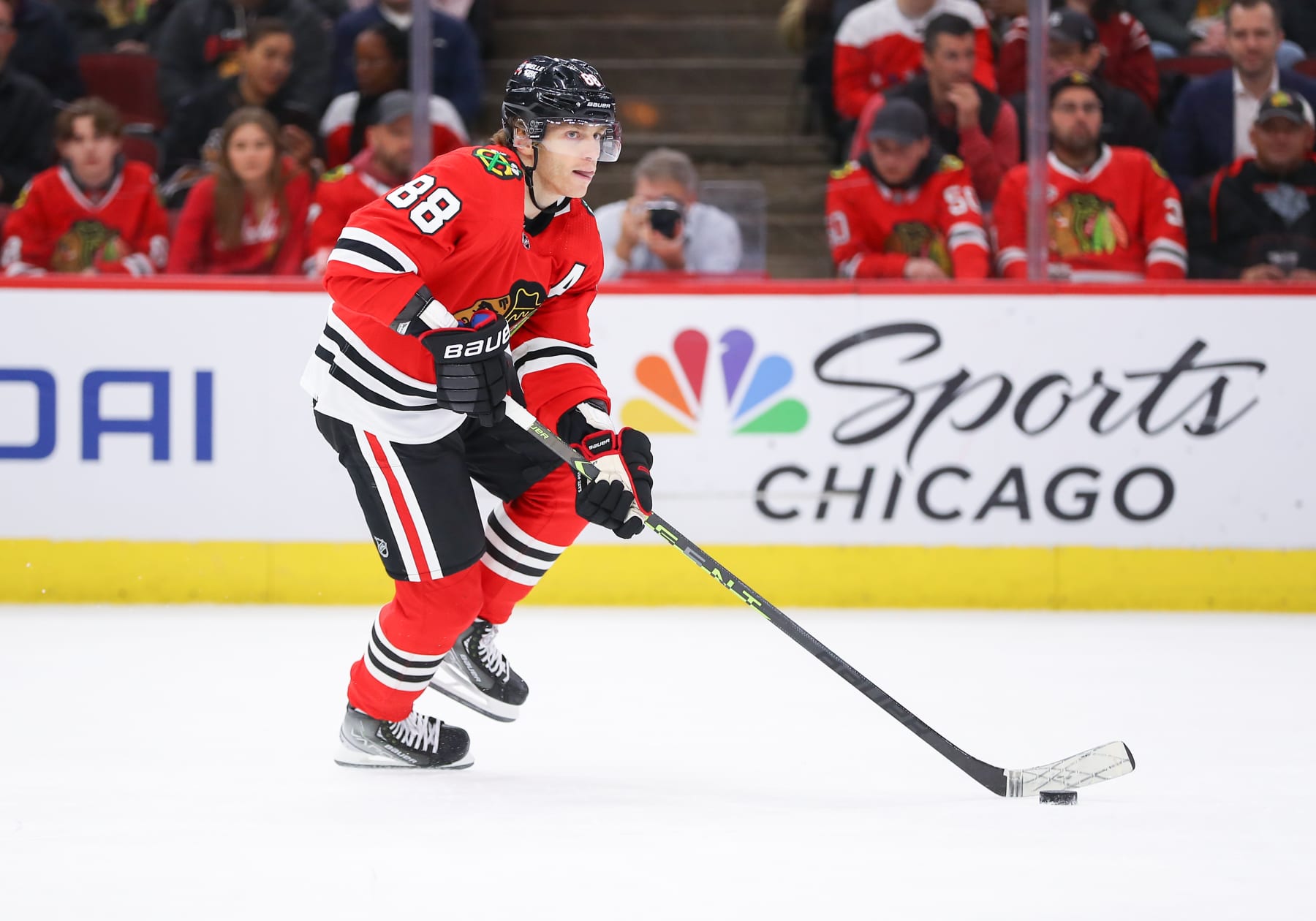 CHICAGO, IL - DECEMBER 13: Chicago Blackhawks Right Wing Patrick Kane (88) skates with the puck in action during a game between the Washington Capitals and the Chicago Blackhawks on December 13, 2022 at the United Center in Chicago, IL. (Photo by Melissa Tamez/Icon Sportswire via Getty Images)