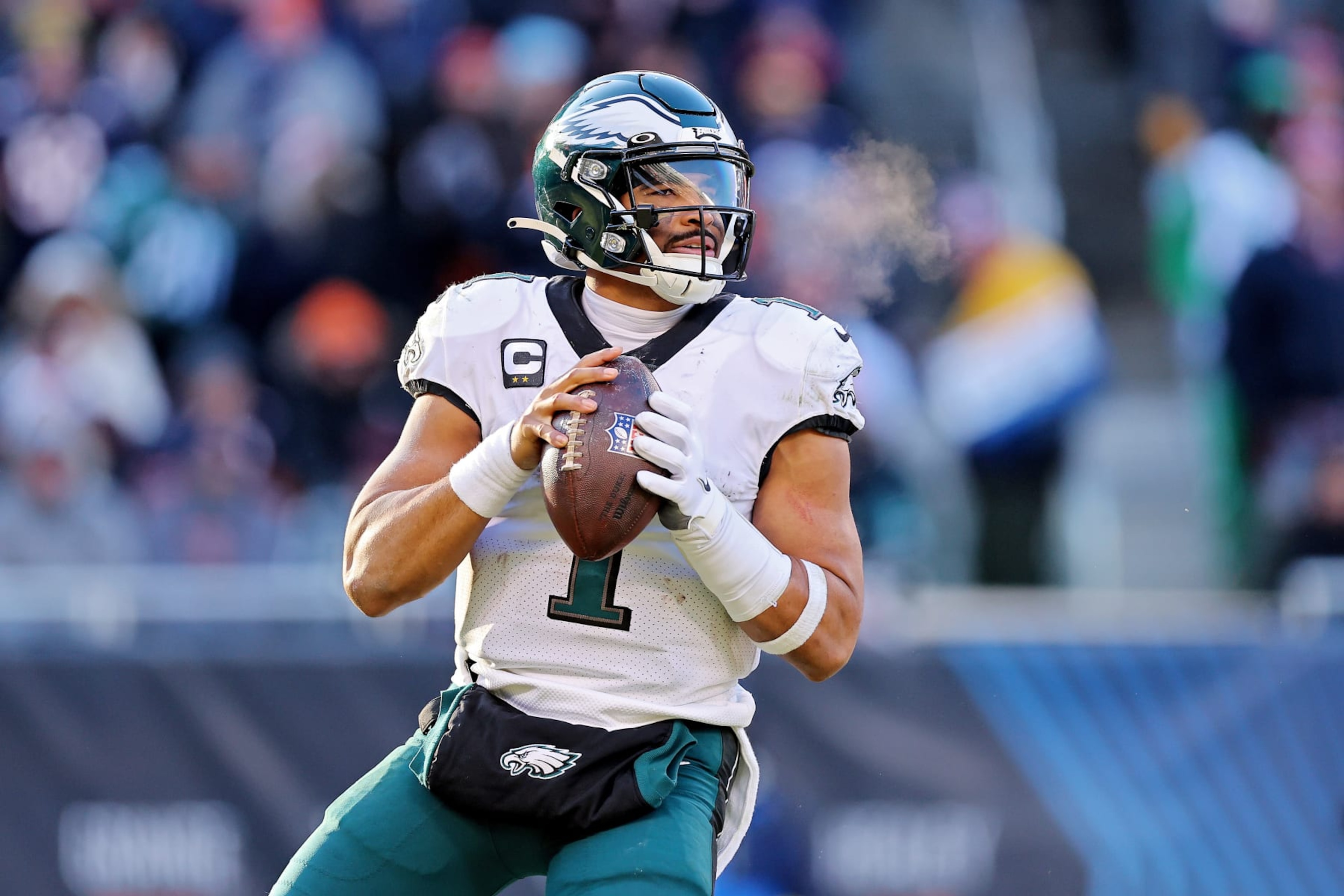 CHICAGO, ILLINOIS - DECEMBER 18: Jalen Hurts #1 of the Philadelphia Eagles looks to pass during the second half in the game against the Chicago Bears at Soldier Field on December 18, 2022 in Chicago, Illinois. (Photo by Michael Reaves/Getty Images) CHICAGO, ILLINOIS - DECEMBER 18: Jalen Hurts #1 of the Philadelphia Eagles looks to pass during the second half in the game against the Chicago Bears at Soldier Field on December 18, 2022 in Chicago, Illinois. (Photo by Michael Reaves/Getty Images)