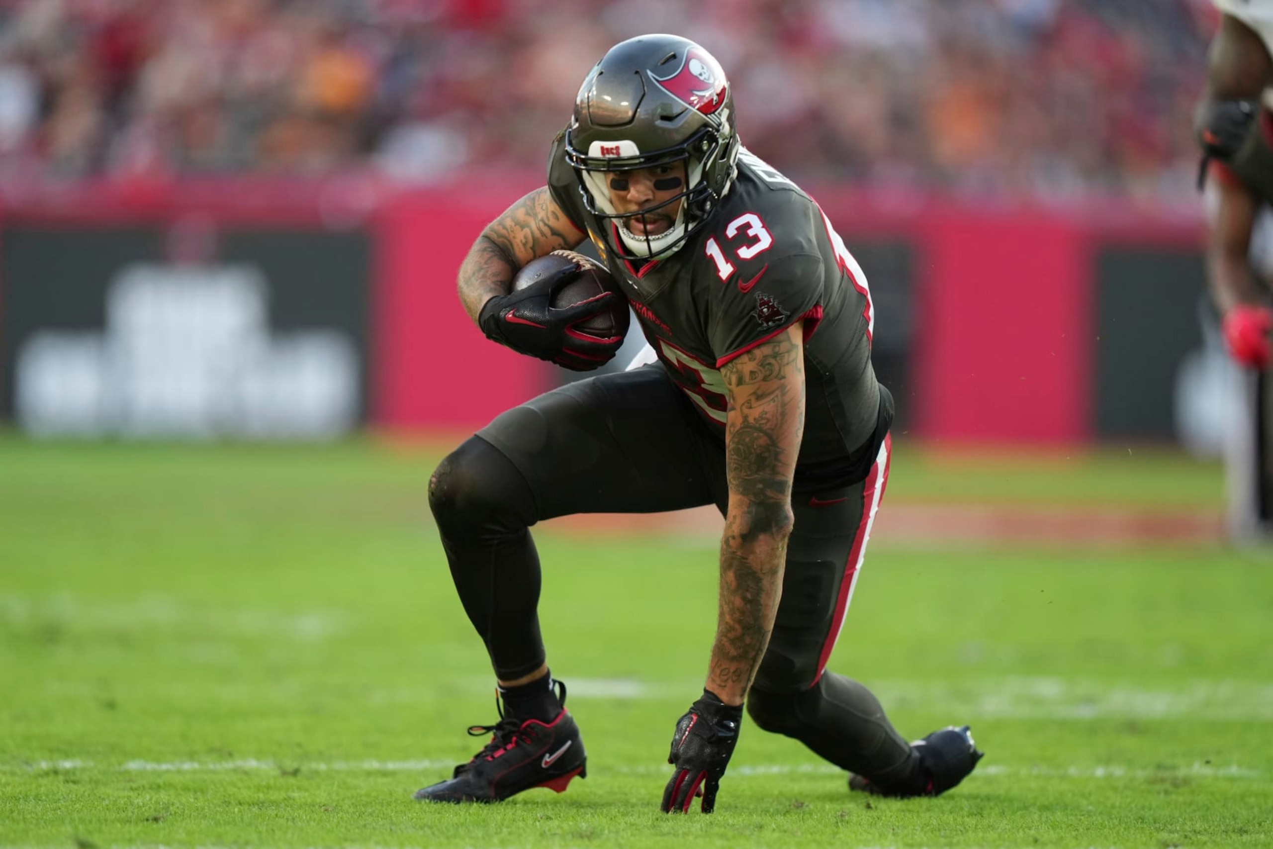 Tampa Bay Buccaneers wide receiver Mike Evans (13) gets up to run after making a diving reception during an NFL football game against the Cincinnati Bengals, Sunday, Dec. 18, 2022, in Tampa, Fla. (AP Photo/Peter Joneleit)