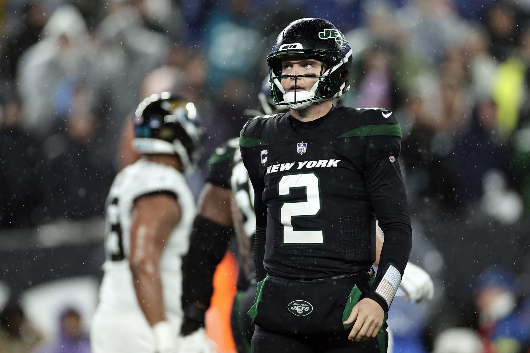 New York Jets quarterback Zach Wilson (2) reacts against the Jacksonville Jaguars during an NFL football game Thursday, Dec. 22, 2022, in East Rutherford, N.J. (AP Photo/Adam Hunger)