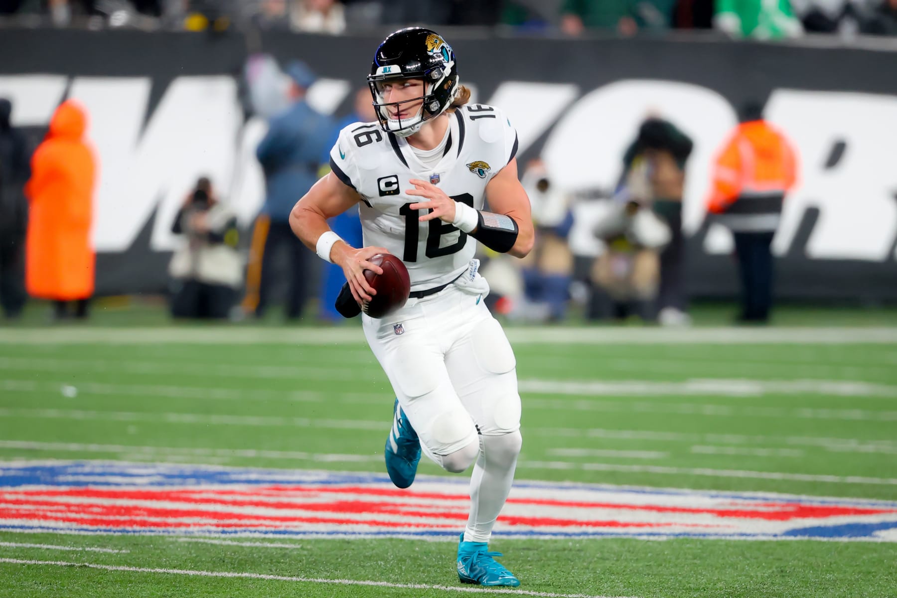 EAST RUTHERFORD, NJ - DECEMBER 22:  Jacksonville Jaguars quarterback Trevor Lawrence (16) runs during the first quarter of the game between the New York Jets and the Jacksonville Jaguars on December 22, 2022 at MetLife Stadium in East Rutherford, New Jersey.  (Photo by Rich Graessle/Icon Sportswire via Getty Images)