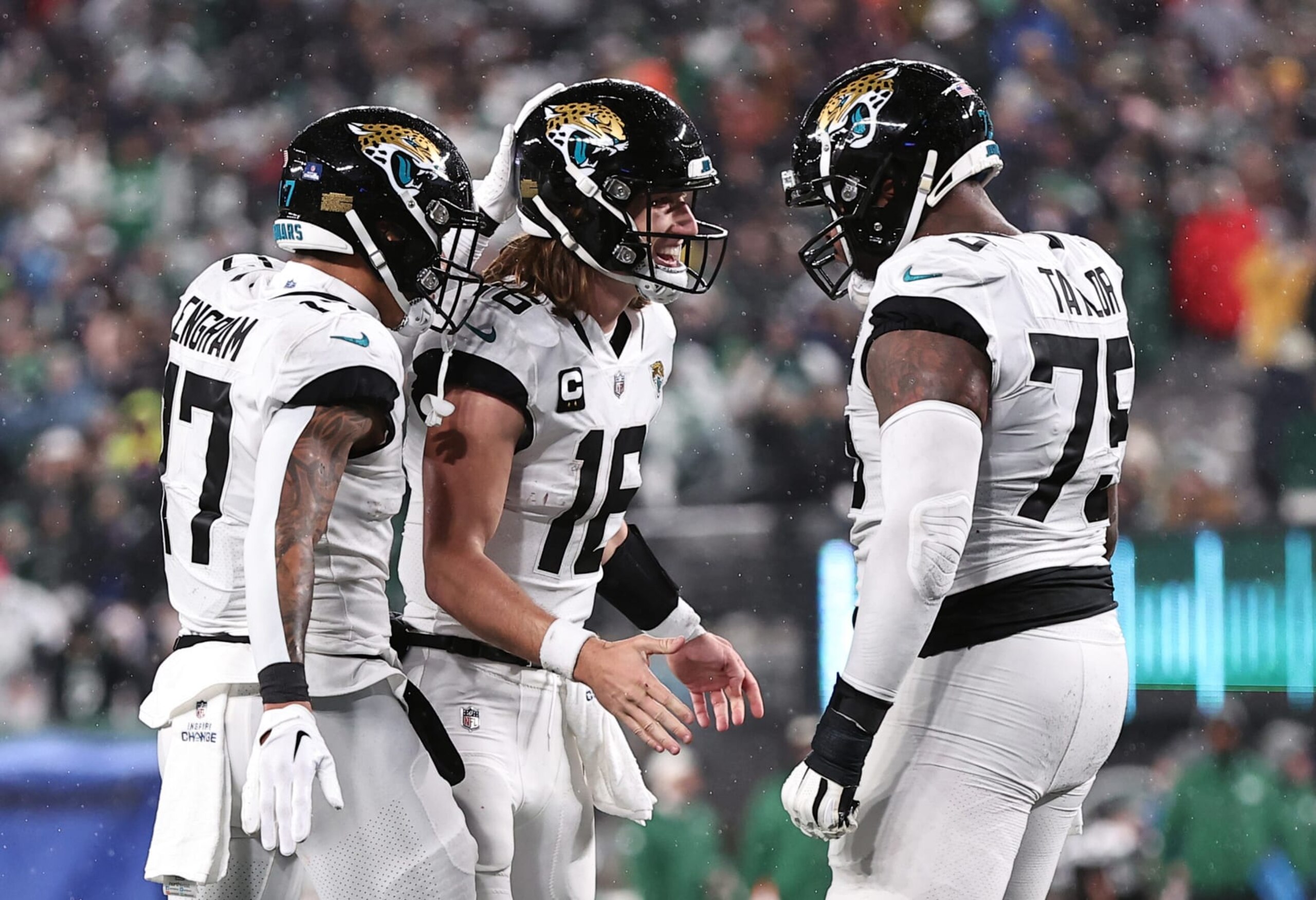 EAST RUTHERFORD, NEW JERSEY - DECEMBER 22:  Trevor Lawrence #16 of the Jacksonville Jaguars celebrates with Evan Engram #17 and Jawaan Taylor #75 after a touchdown during the 1st half of the game at MetLife Stadium on December 22, 2022 in East Rutherford, New Jersey. (Photo by Dustin Satloff/Getty Images)