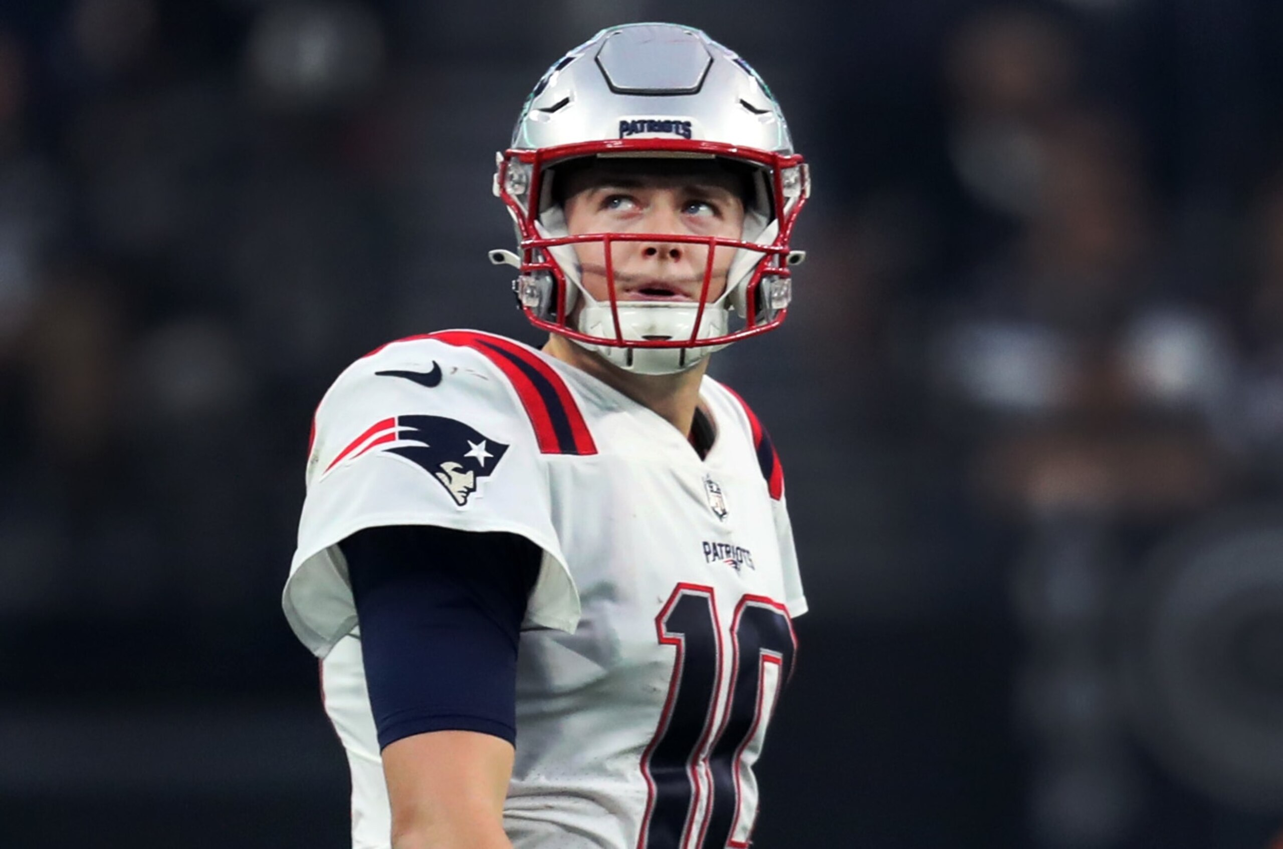 Paradise, NV - December 18: New England Patriots QB Mac Jones looks to the side late in the game. The Patriots were defeated by the Las Vegas Raiders, 30-24. (Photo by Jim Davis/The Boston Globe via Getty Images)