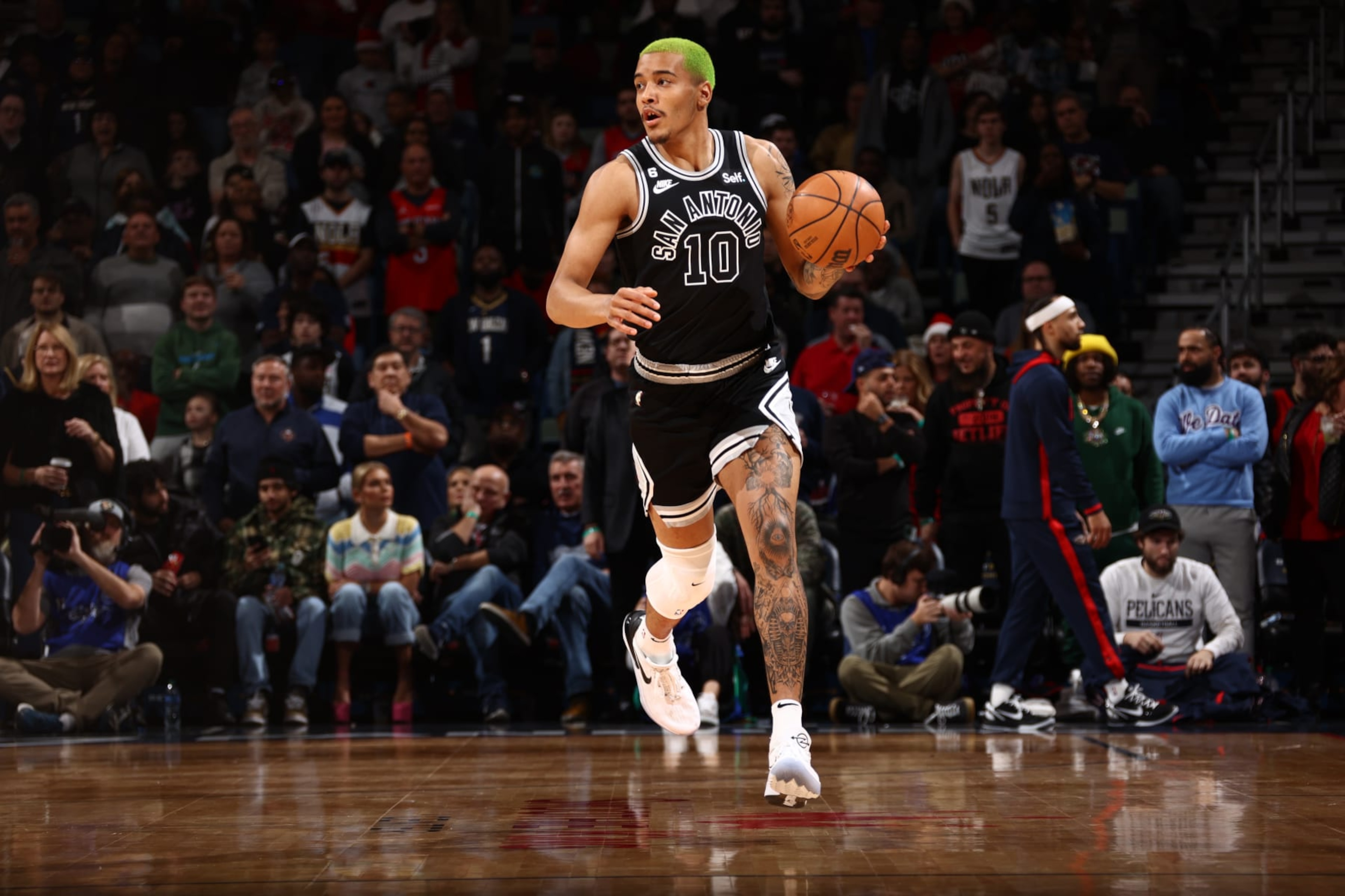 NEW ORLEANS, LA - DECEMBER 22: Jeremy Sochan #10 of the San Antonio Spurs dribbles the ball during the game against the New Orleans Pelicans on December 22, 2022 at the Smoothie King Center in New Orleans, Louisiana. NOTE TO USER: User expressly acknowledges and agrees that, by downloading and or using this Photograph, user is consenting to the terms and conditions of the Getty Images License Agreement. Mandatory Copyright Notice: Copyright 2022 NBAE (Photo by Ned Dishman/NBAE via Getty Images) NEW ORLEANS, LA - DECEMBER 22: Jeremy Sochan #10 of the San Antonio Spurs dribbles the ball during the game against the New Orleans Pelicans on December 22, 2022 at the Smoothie King Center in New Orleans, Louisiana. NOTE TO USER: User expressly acknowledges and agrees that, by downloading and or using this Photograph, user is consenting to the terms and conditions of the Getty Images License Agreement. Mandatory Copyright Notice: Copyright 2022 NBAE (Photo by Ned Dishman/NBAE via Getty Images)