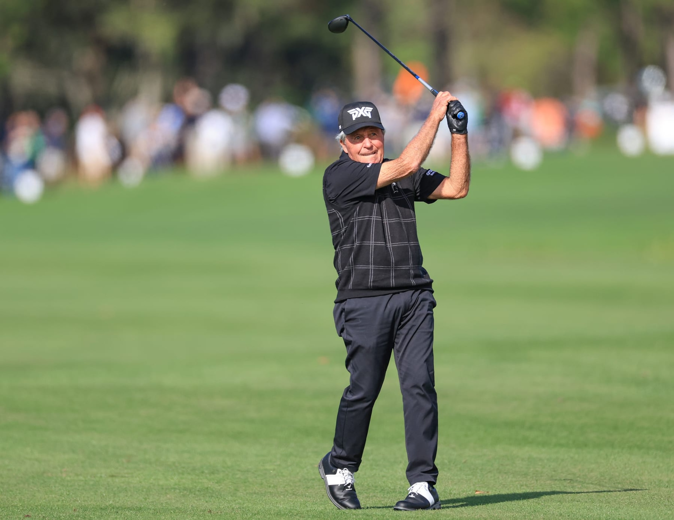 ORLANDO, FLORIDA - DECEMBER 16: Gary Player of South Africa  plays his second shot on the 18th hole during the Friday pro-am as a preview for the 2022 PNC Championship at The Ritz-Carlton Golf Club on December 16, 2022 in Orlando, Florida. (Photo by David Cannon/Getty Images)