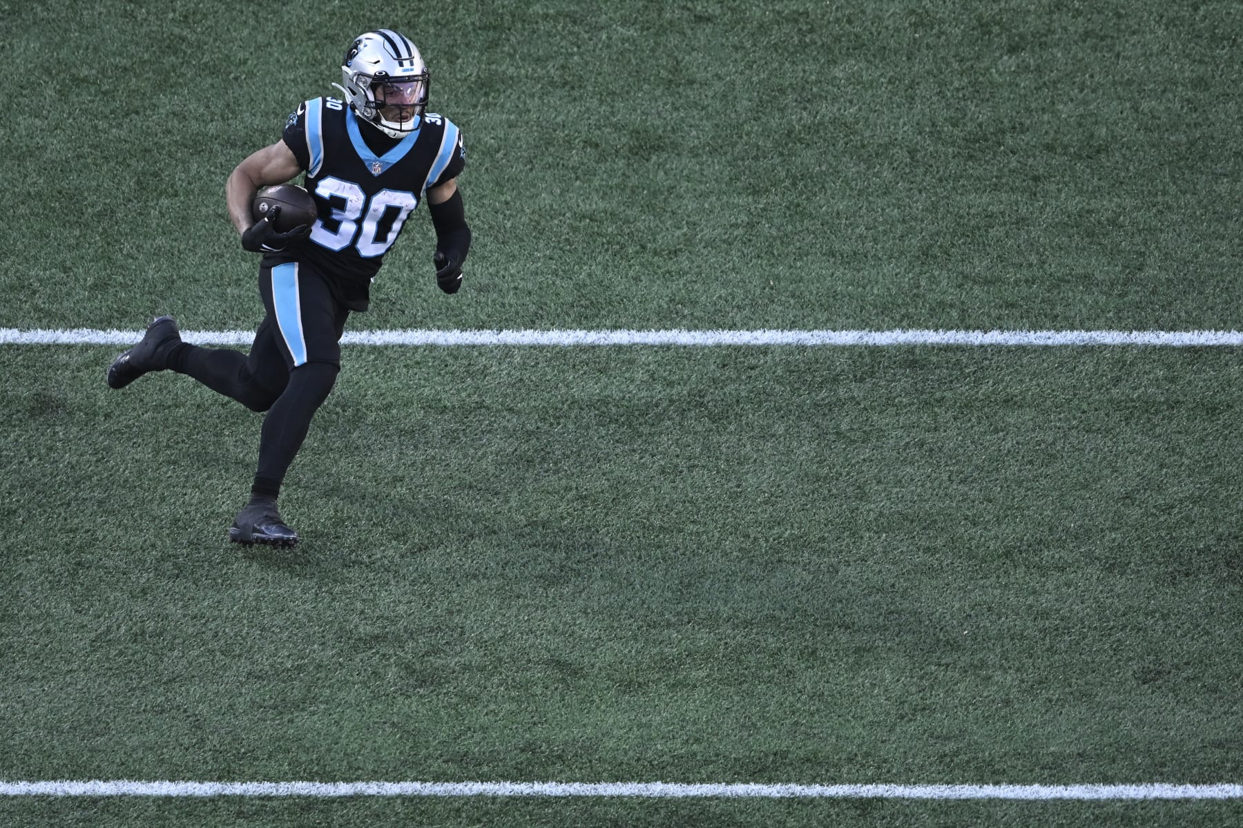 CHARLOTTE, NORTH CAROLINA - DECEMBER 18: Chuba Hubbard #30 of the Carolina Panthers runs the ball against the Pittsburgh Steelers in the third quarter at Bank of America Stadium on December 18, 2022 in Charlotte, North Carolina. (Photo by Eakin Howard/Getty Images)