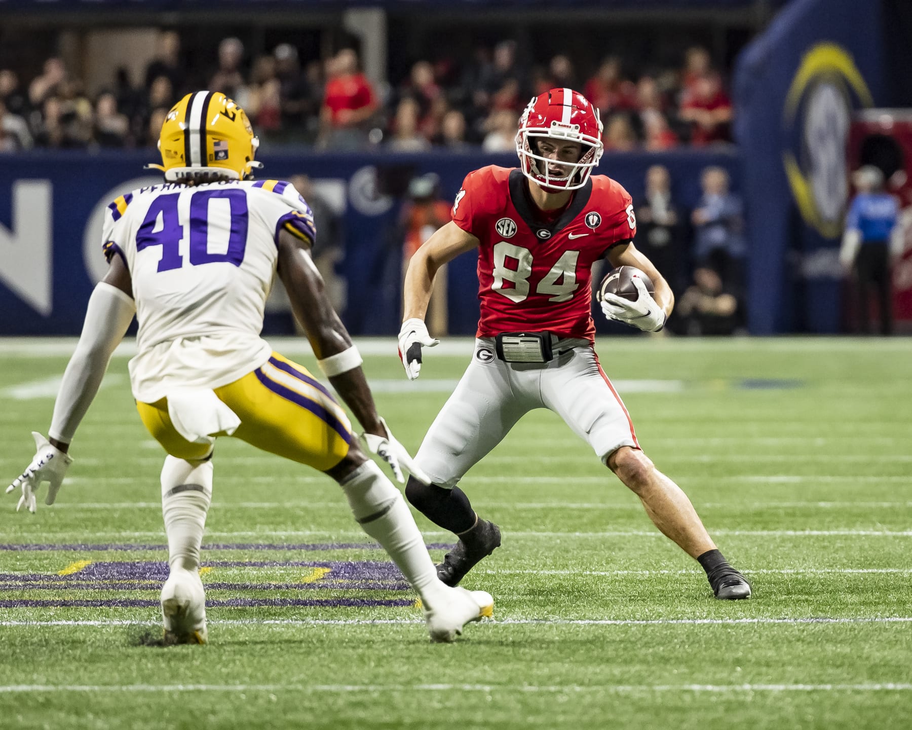 ATLANTA, GA - DECEMBER 3: Ladd McConkey #84 of the Georgia Bulldogs makes a move on Harold Perkins Jr. #40 of the LSU Tigers during a game between LSU Tigers and Georgia Bulldogs at Mercedes-Benz Stadium on December 3, 2022 in Atlanta, Georgia. (Photo by Steve Limentani/ISI Photos/Getty Images)