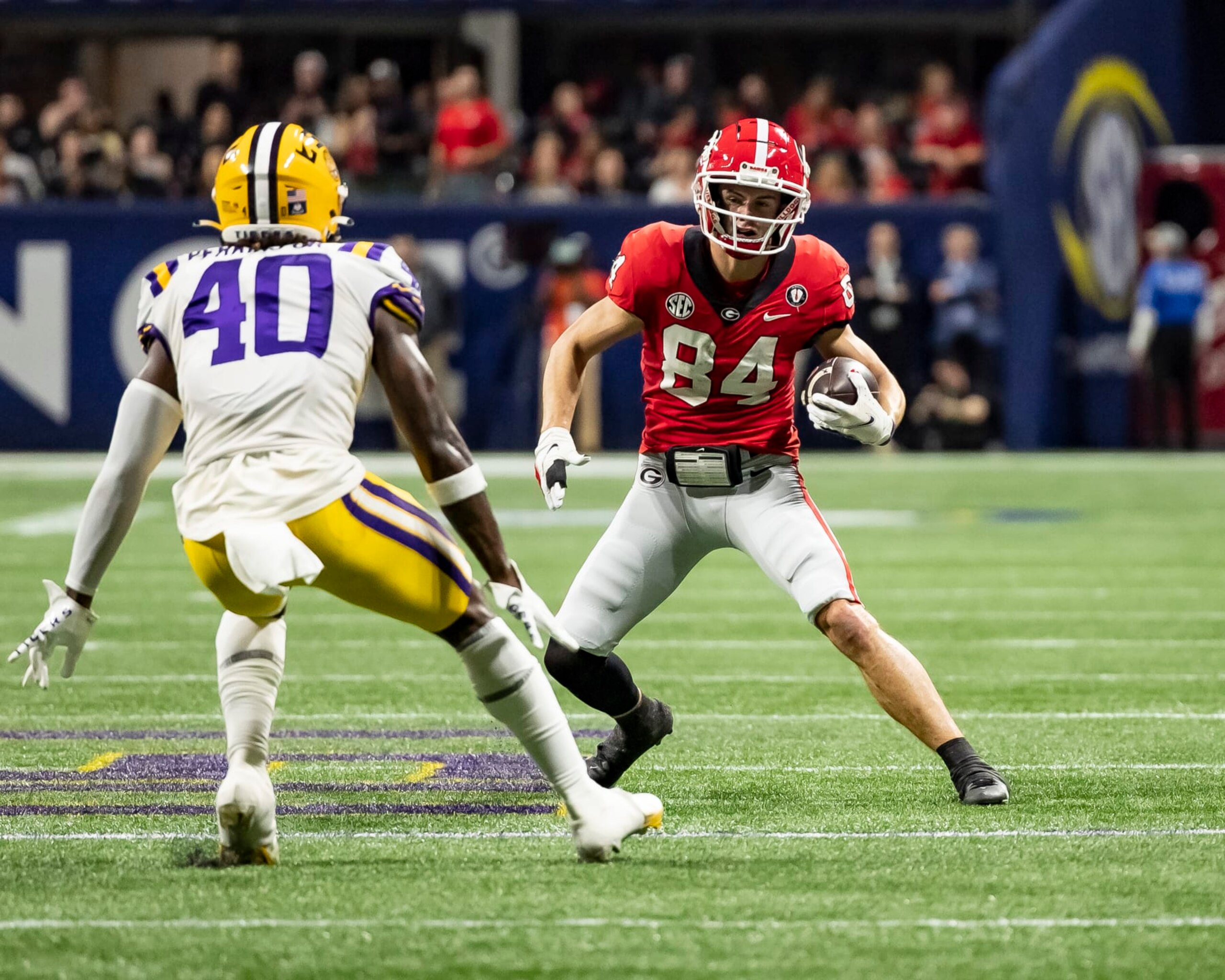 ATLANTA, GA - DECEMBER 3: Ladd McConkey #84 of the Georgia Bulldogs makes a move on Harold Perkins Jr. #40 of the LSU Tigers during a game between LSU Tigers and Georgia Bulldogs at Mercedes-Benz Stadium on December 3, 2022 in Atlanta, Georgia. (Photo by Steve Limentani/ISI Photos/Getty Images)