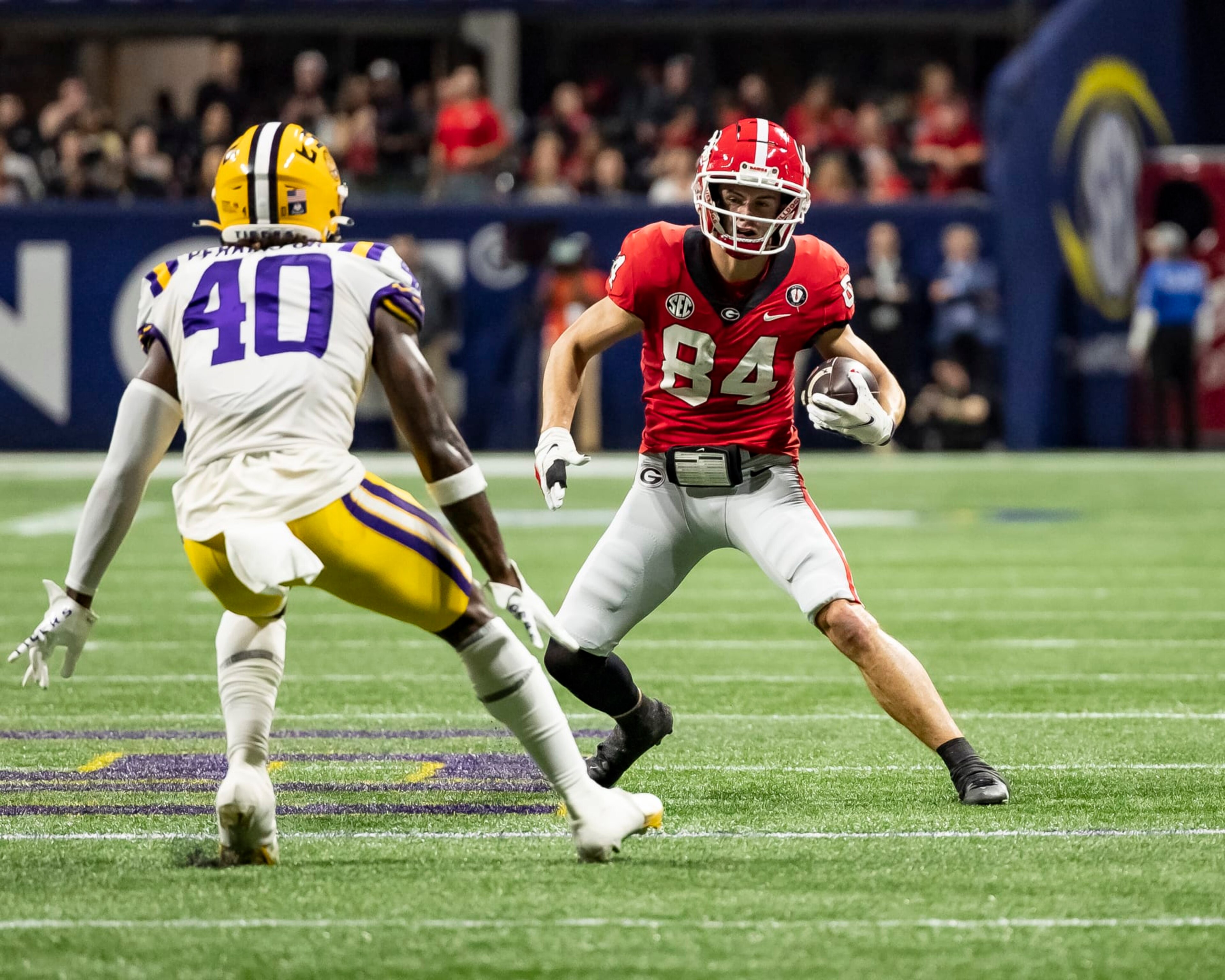 ATLANTA, GA - DECEMBER 3: Ladd McConkey #84 of the Georgia Bulldogs makes a move on Harold Perkins Jr. #40 of the LSU Tigers during a game between LSU Tigers and Georgia Bulldogs at Mercedes-Benz Stadium on December 3, 2022 in Atlanta, Georgia. (Photo by Steve Limentani/ISI Photos/Getty Images) ATLANTA, GA - DECEMBER 3: Ladd McConkey #84 of the Georgia Bulldogs makes a move on Harold Perkins Jr. #40 of the LSU Tigers during a game between LSU Tigers and Georgia Bulldogs at Mercedes-Benz Stadium on December 3, 2022 in Atlanta, Georgia. (Photo by Steve Limentani/ISI Photos/Getty Images)