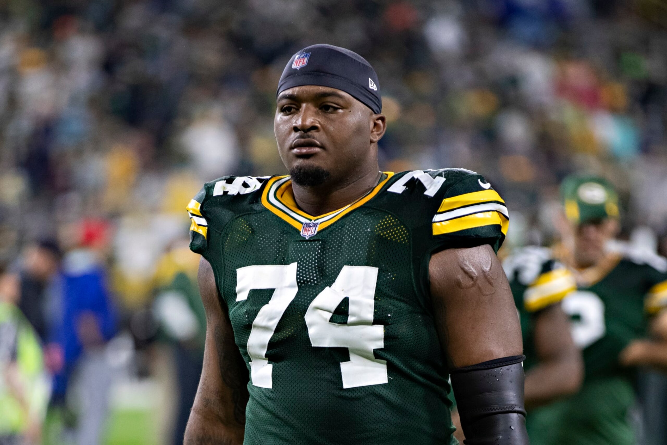GREEN BAY, WI - SEPTEMBER 20:  Elgton Jenkins #74 of the Green Bay Packers walks off the field after a game against the Detroit Lions at Lambeau Field on September 20, 2021 in Green Bay, Wisconsin.  The Packers defeated the Lions 35-17.  (Photo by Wesley Hitt/Getty Images)