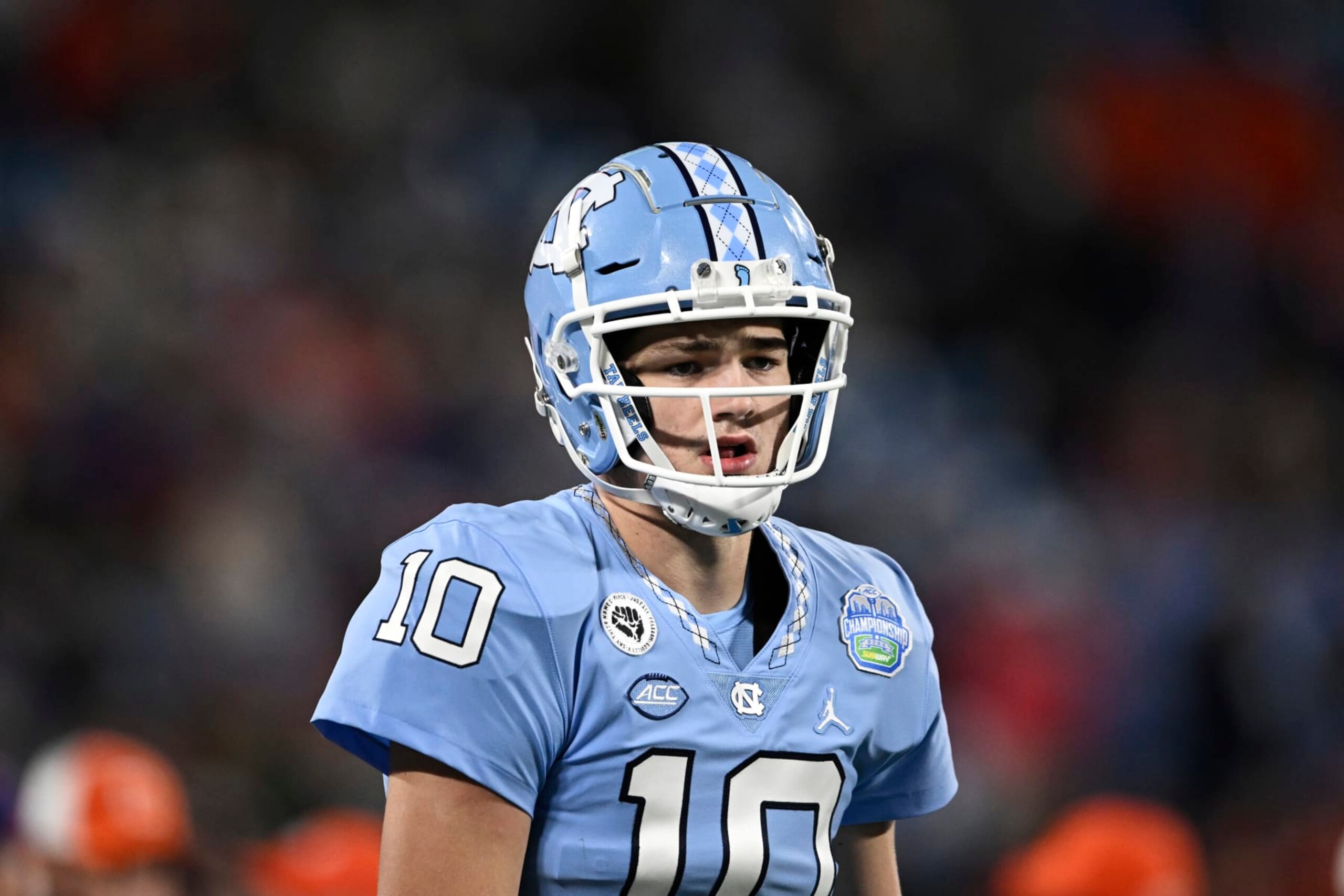 CHARLOTTE, NORTH CAROLINA - DECEMBER 03: Drake Maye #10 of the North Carolina Tar Heels warms up before the ACC Championship game against the Clemson Tigers at Bank of America Stadium on December 03, 2022 in Charlotte, North Carolina. (Photo by Eakin Howard/Getty Images)